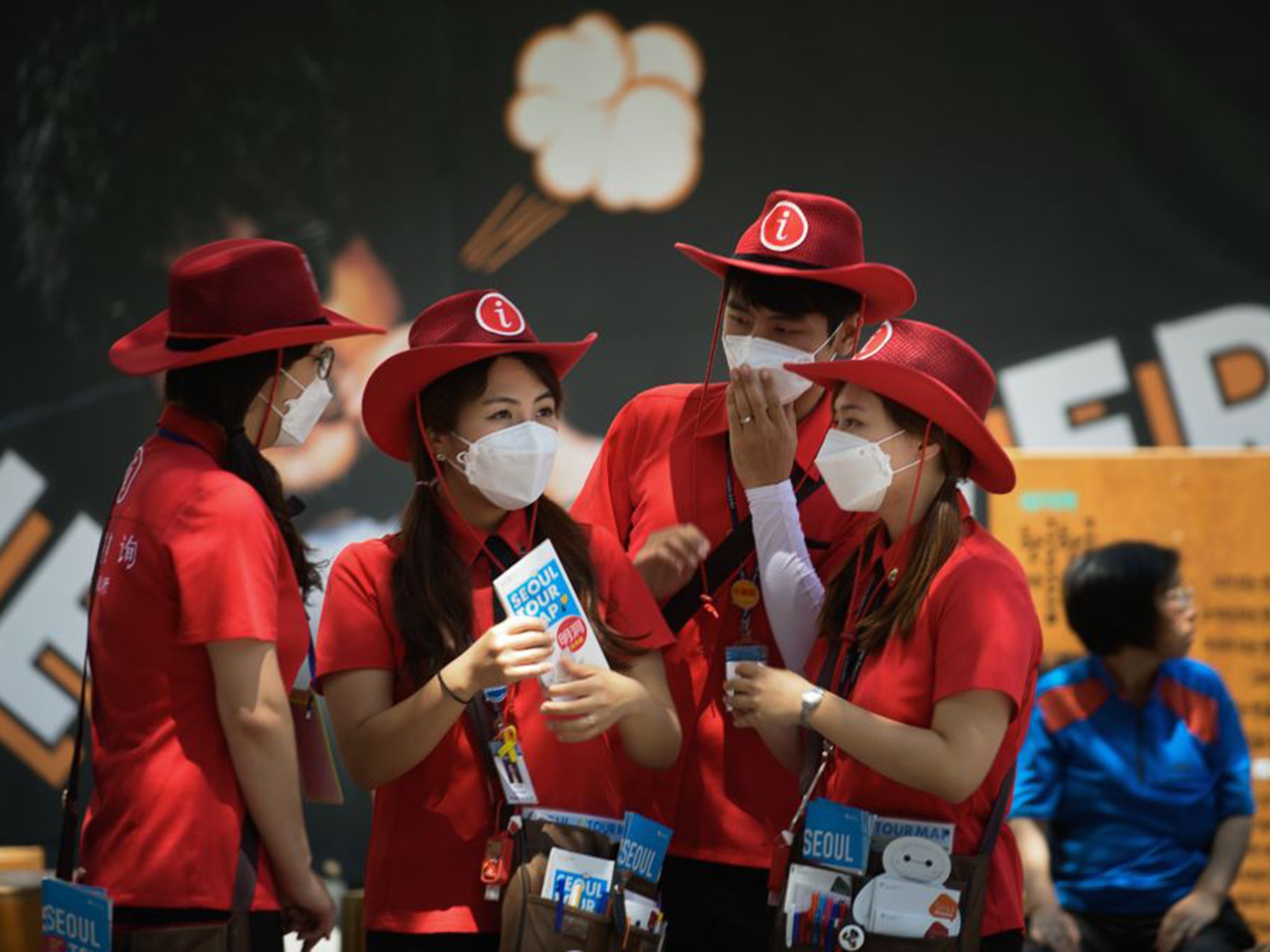 Volunteer tourist assistants in Seoul are attempting to reassure foreign visitors amid reports that 7,000 people – mostly from China – have cancelled planned trips to South Korea due to Mers