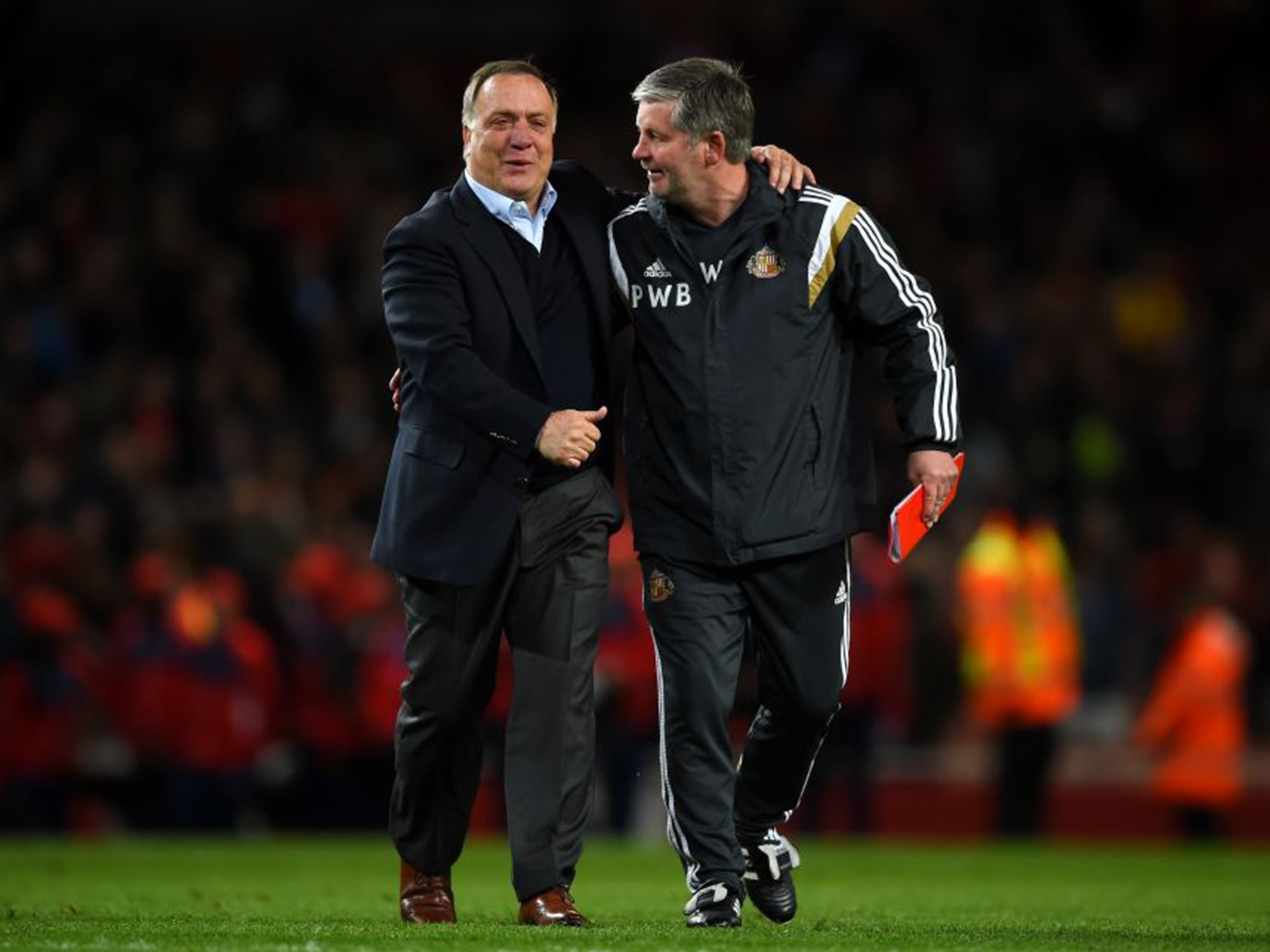 Dick Advocaat, left, celebrates with Sunderland coach Paul Bracewell after securing their Premier League place