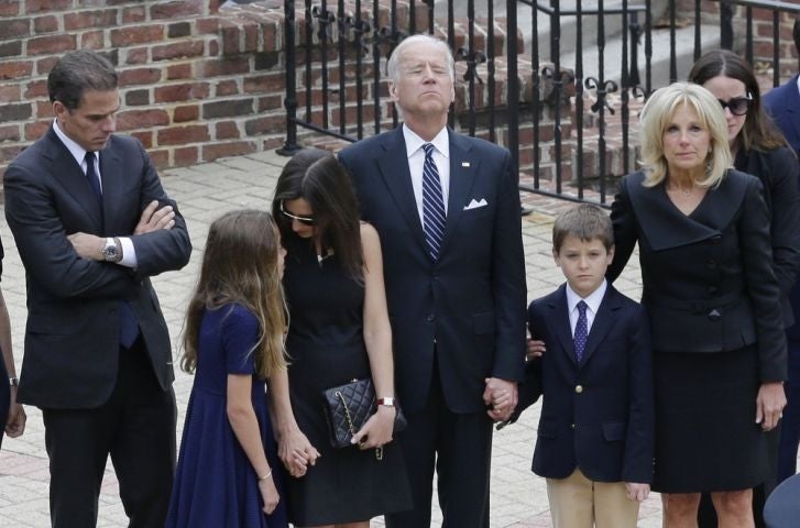 Vice President Joe Biden, center, pauses alongside his family