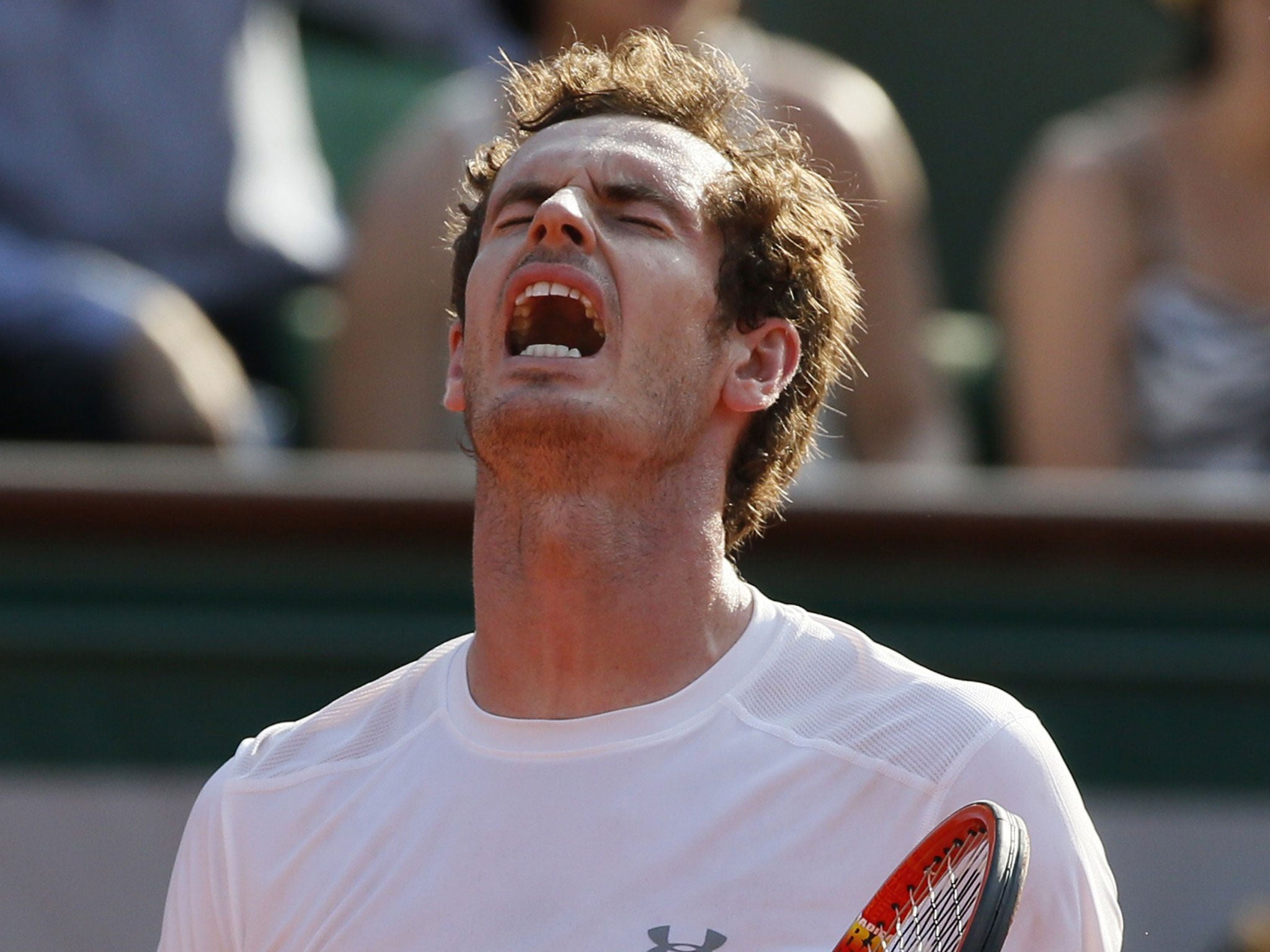 Andy Murray reacts after losing a point