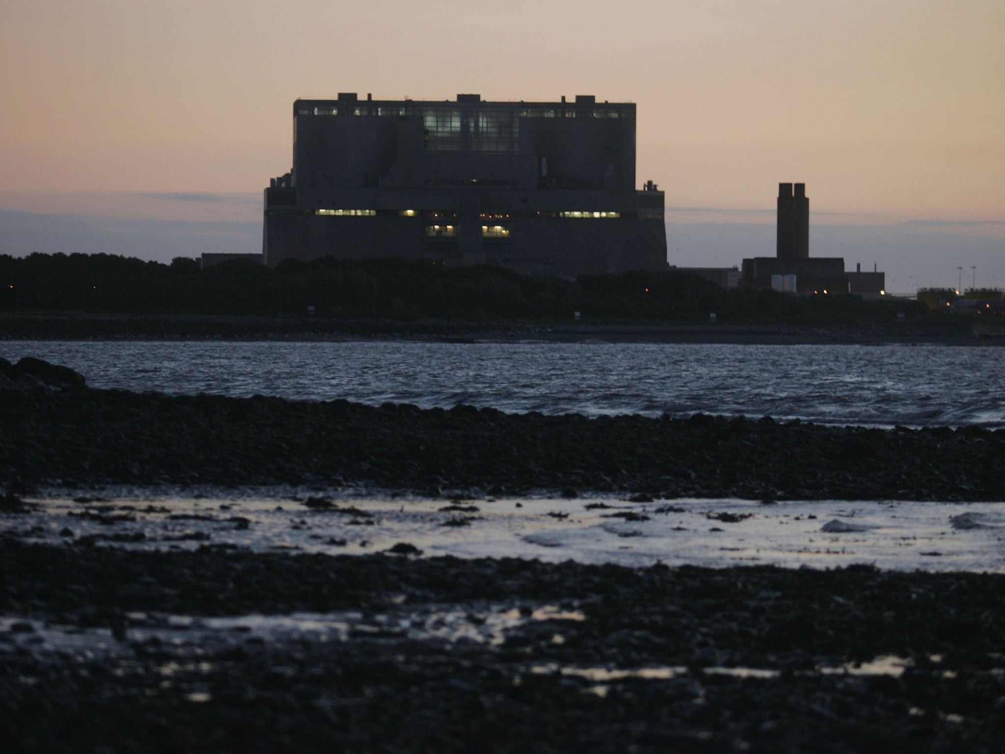 The lights of Hinkley Point Nuclear Power Station are seen on July 17, 2006 in Somerset, England.
