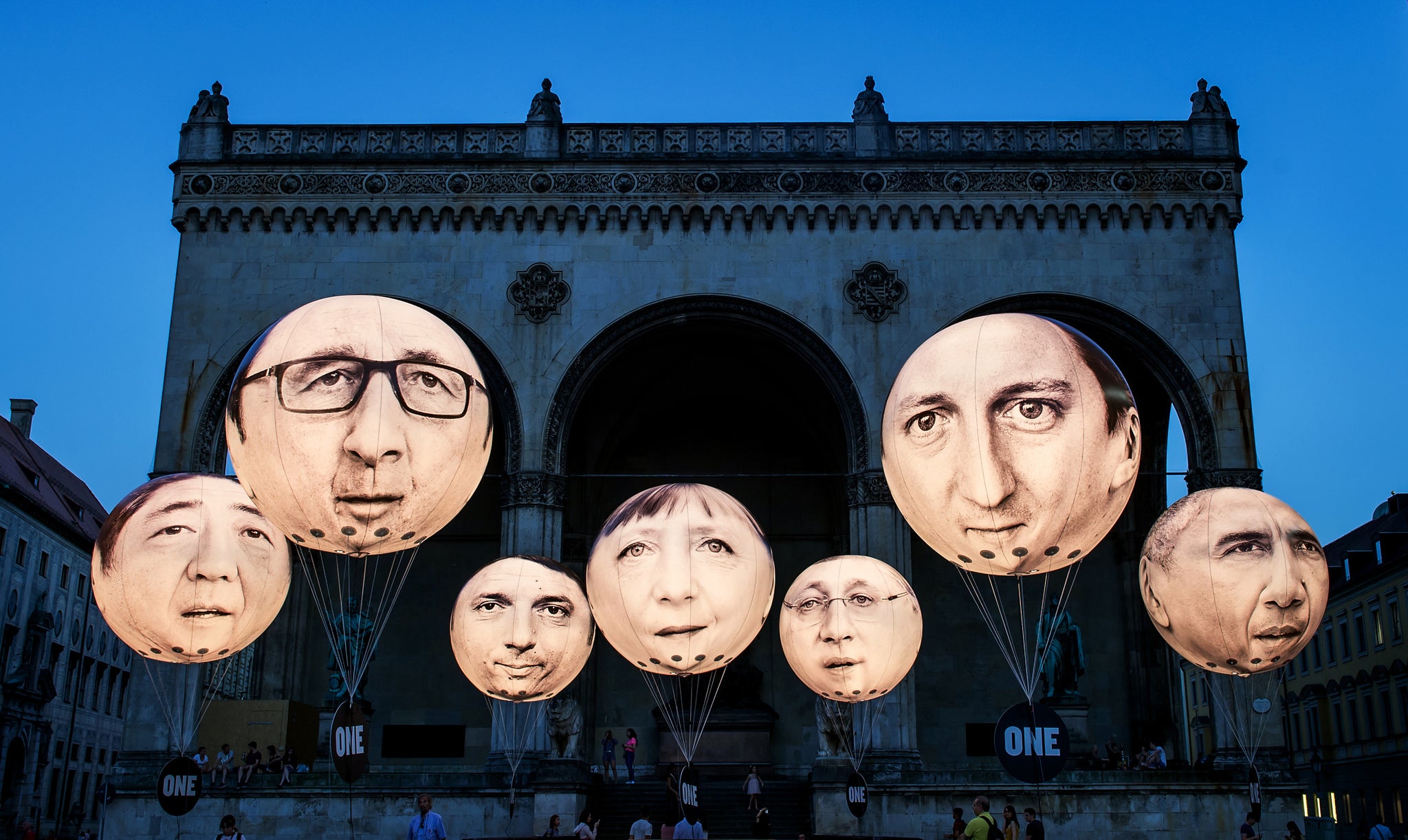 Balloons printed with the faces of the G7 leaders have been installed by activists in Munich