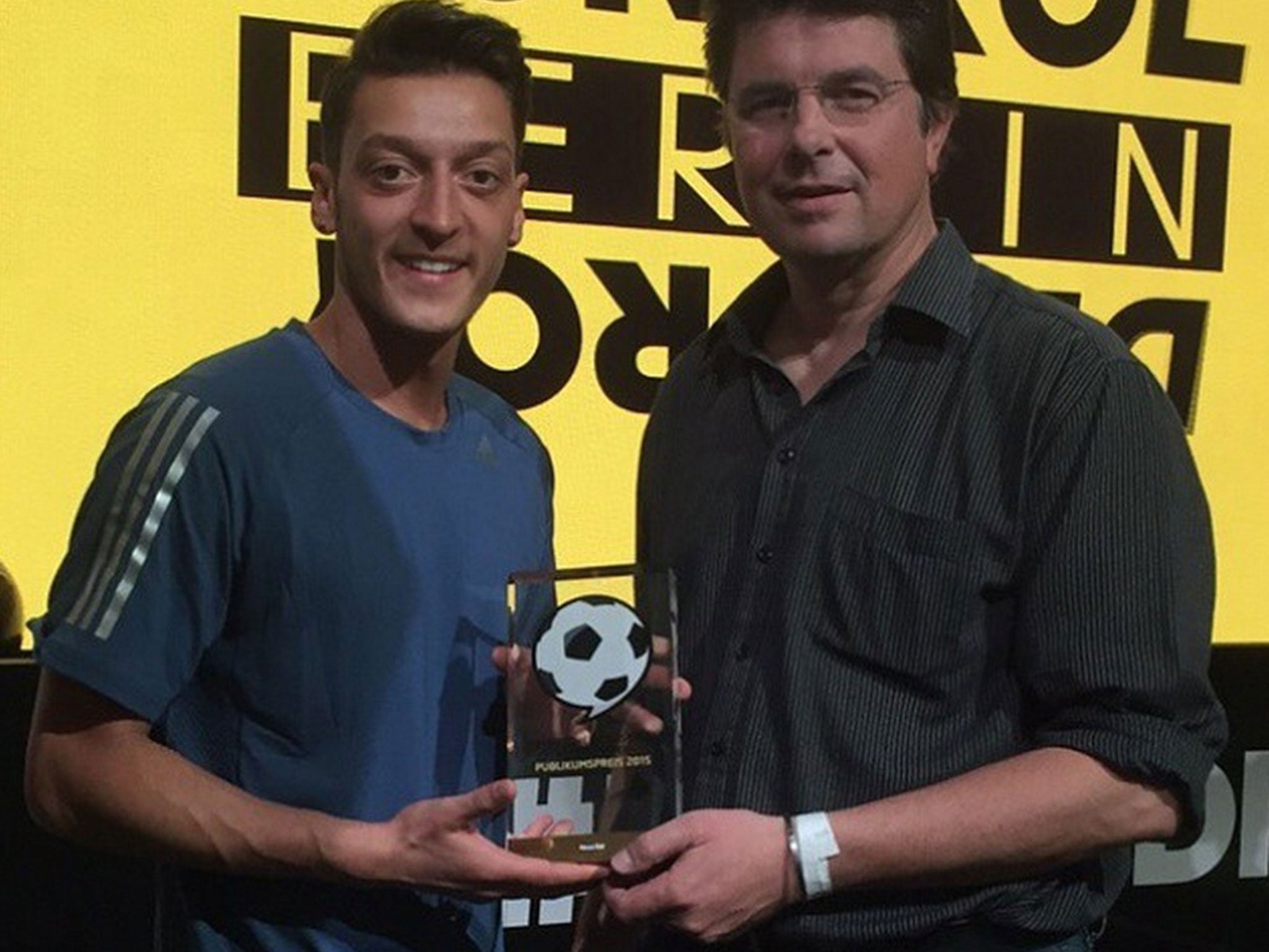 Mesut Ozil receives his German Football Ambassador award