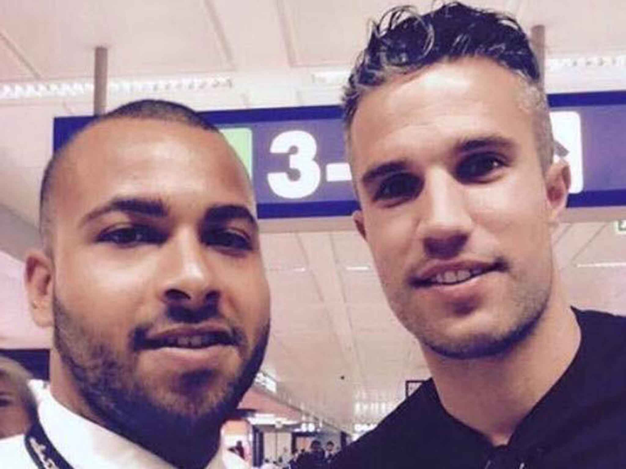 Robin van Persie pictured with a fan at Rome's Fiumicino Airport