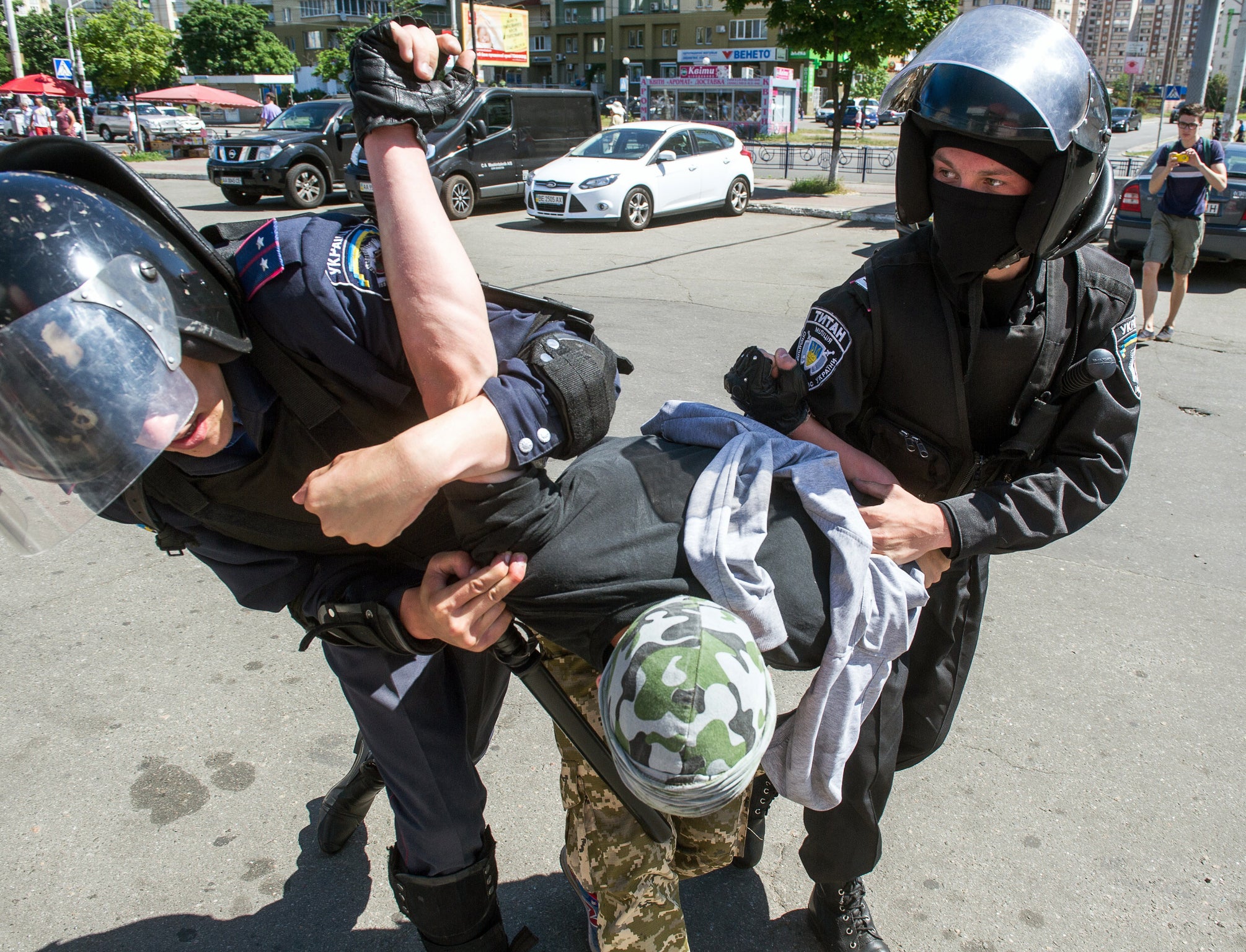 Police restrain a far-right activist at the march (Photo: VOLODYMYR SHUVAYEV/AFP/Getty Images)