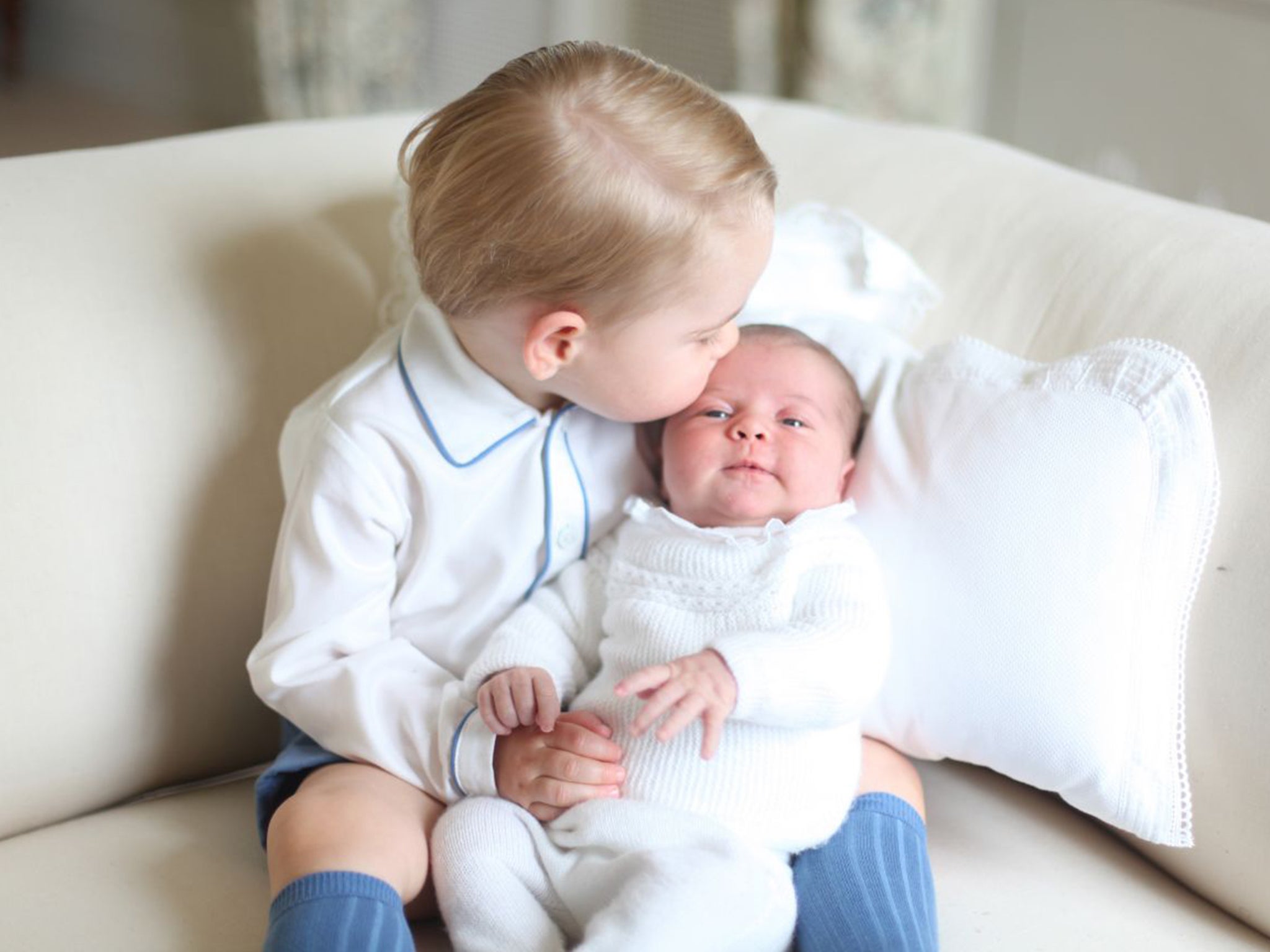 Breaking with royal tradition, the photographs of Prince George and Princess Charlotte were taken by their mother and feature the two royal siblings together