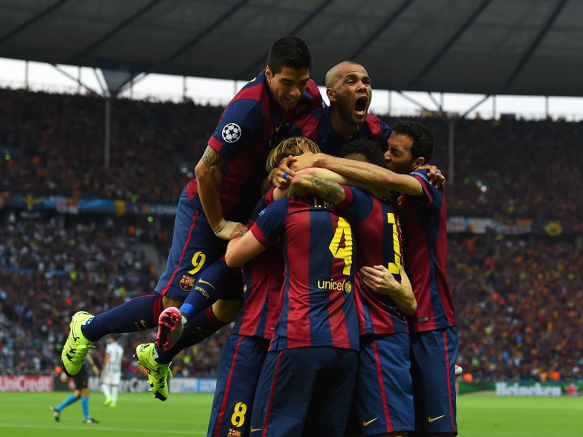 Suarez and Alves celebrate Rakitic's first-half goal