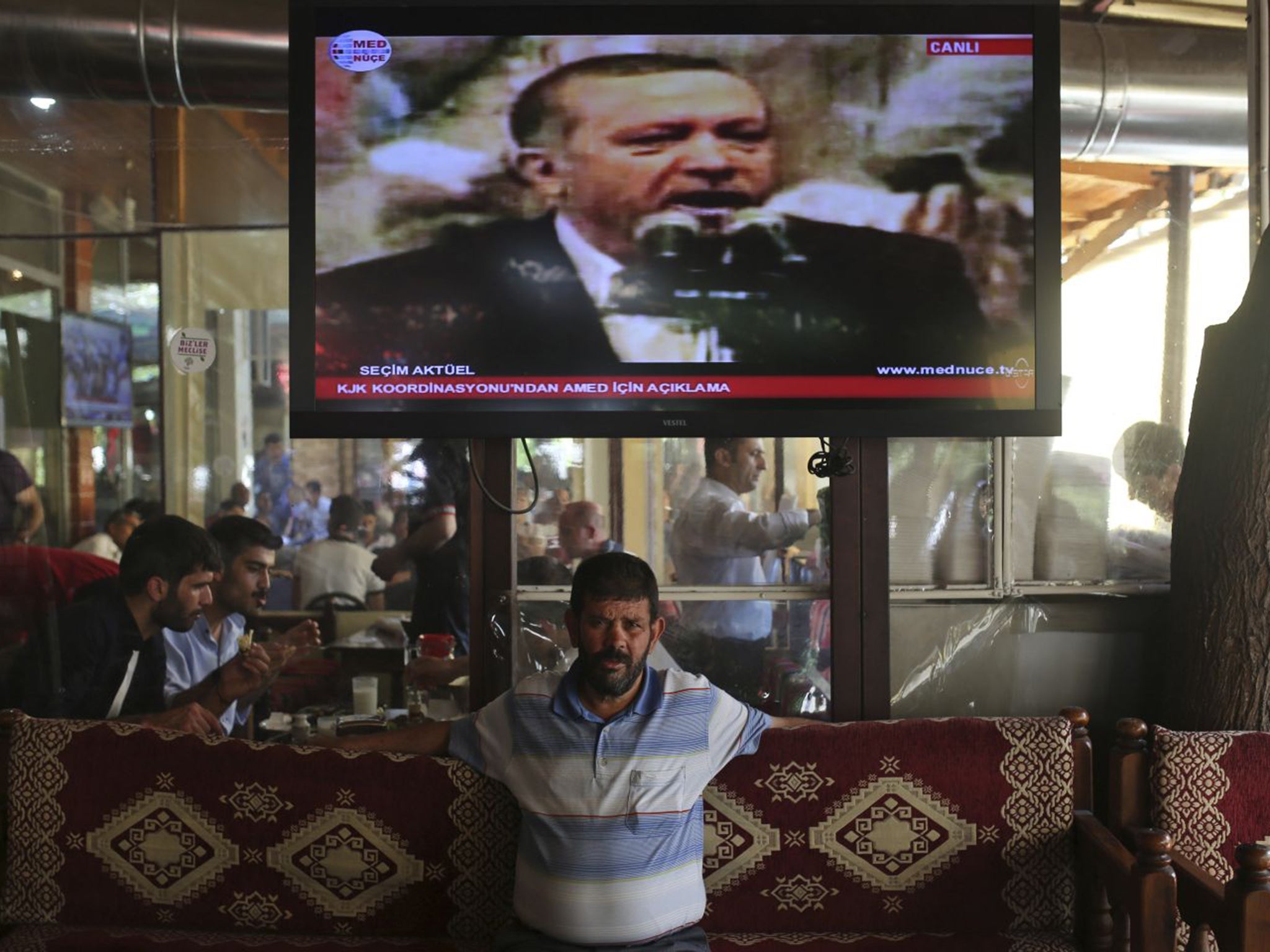 A coffee shop in Turkey as Recep Tayyip Erdogan speaks on TV