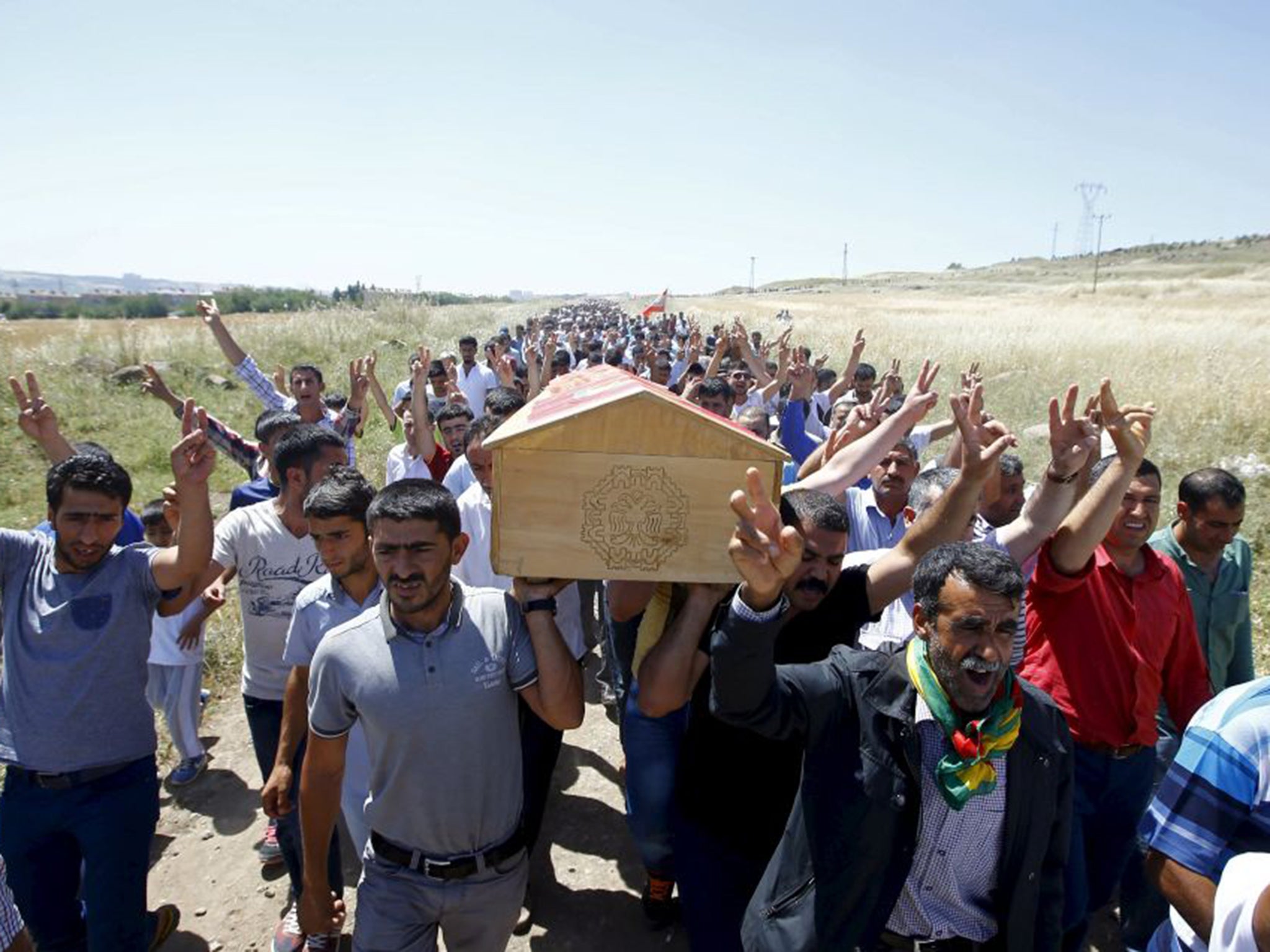 Mourners carry the coffin of Ramazan Yildiz, a victim of Friday’s explosions at an HDP rally in Diyarbakir, south-east Turkey