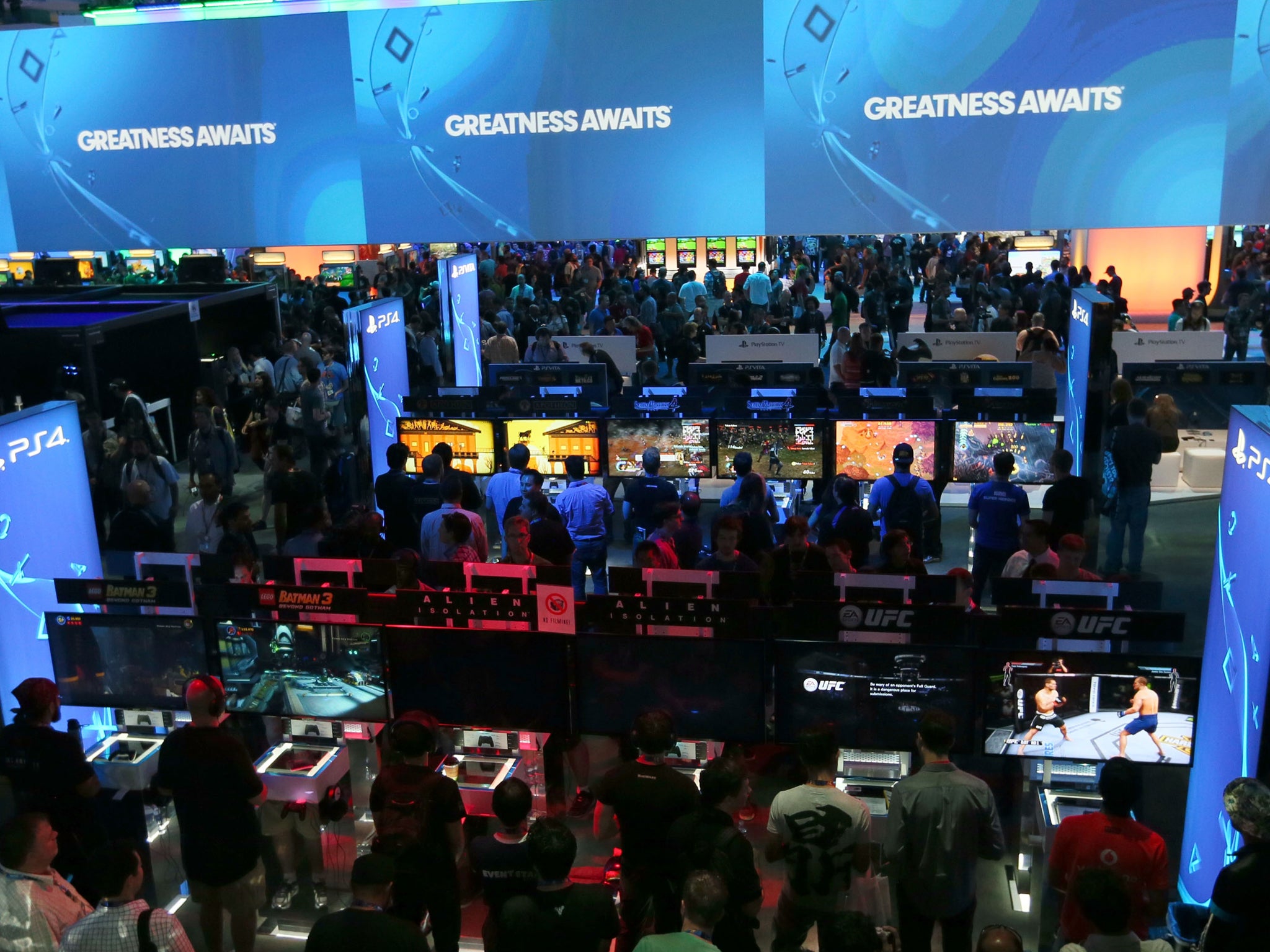 Gamers file in to play new releases on a huge array of screens and consoles at E3