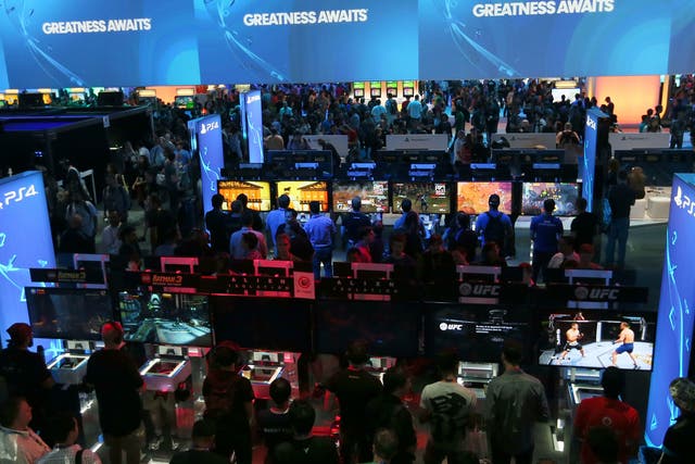 Gamers file in to play new releases on a huge array of screens and consoles at E3