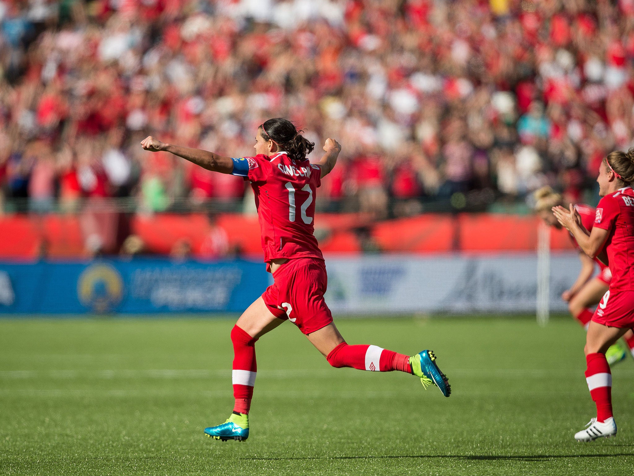 Christine Sinclair celebrates scoring for Canada in the opening game of the Women's World Cup