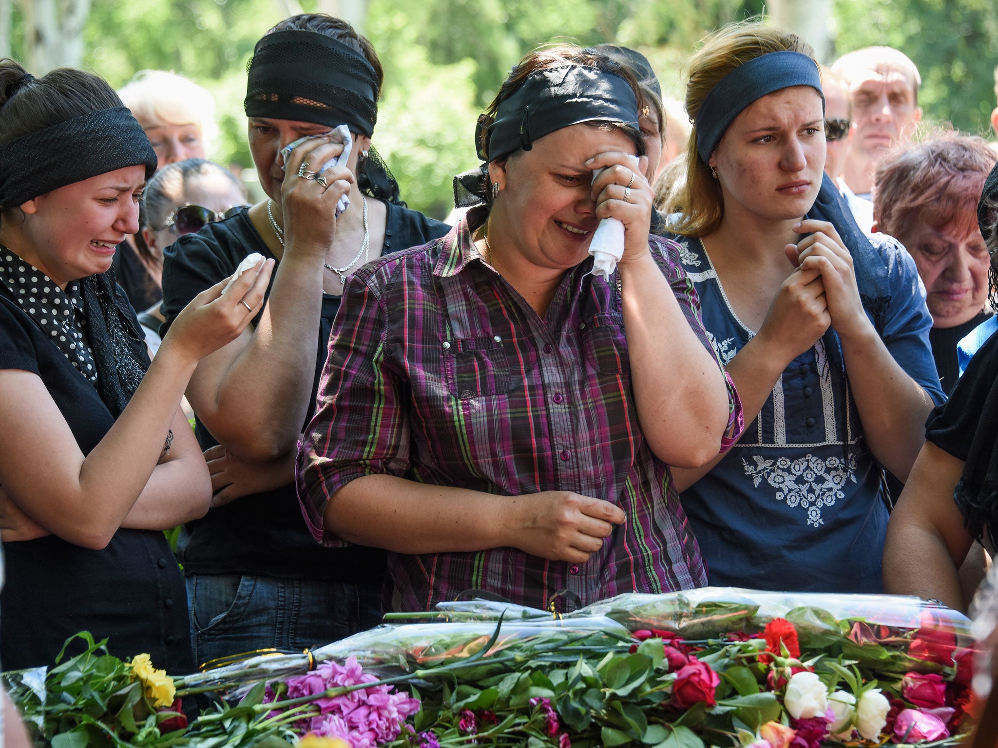 Relatives grieve for pro-Russian separatists killed in a battle in Maryinka