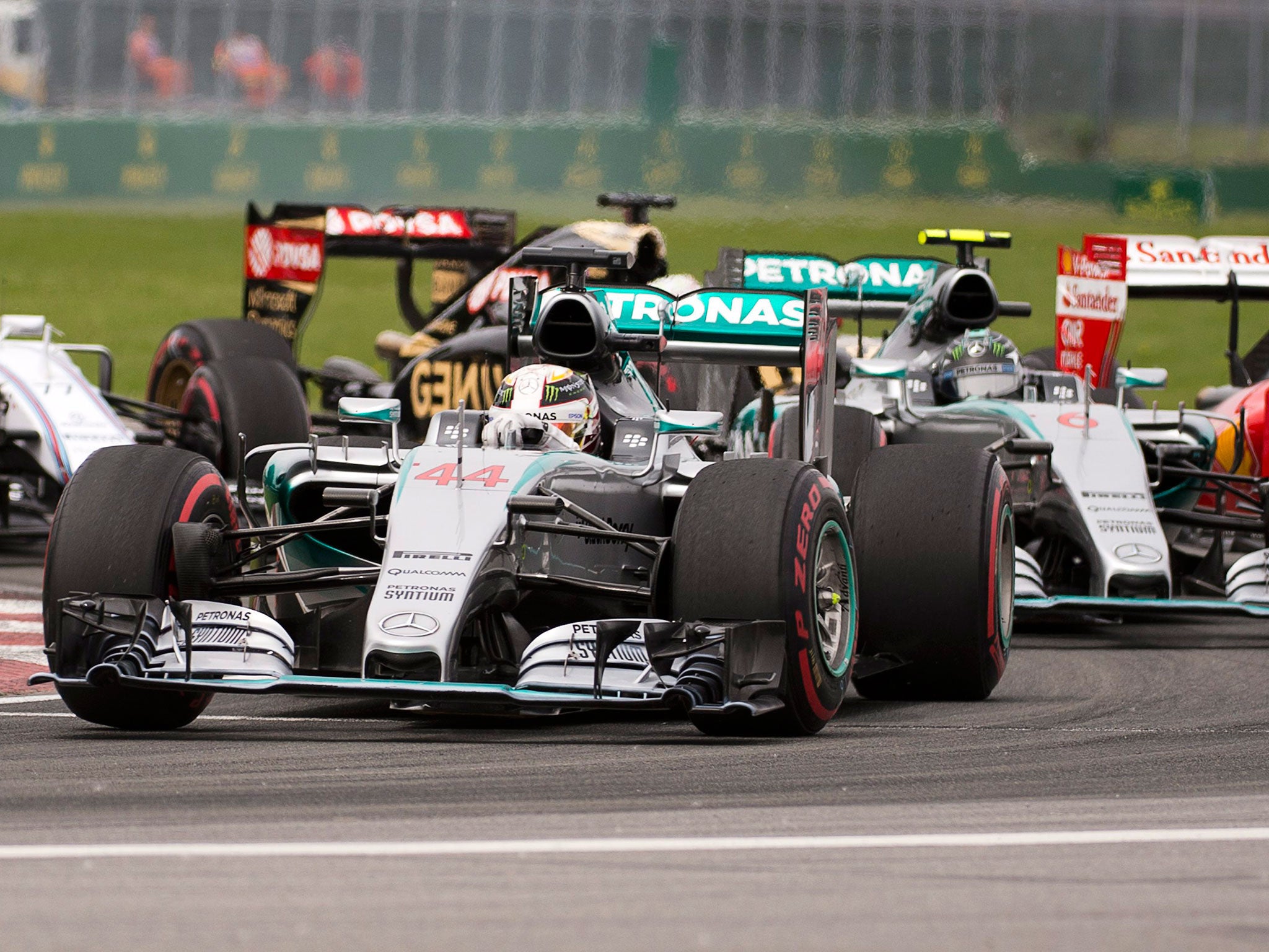 Lewis Hamilton leads Mercedes team-mate Nico Rosberg through the Senna Corner