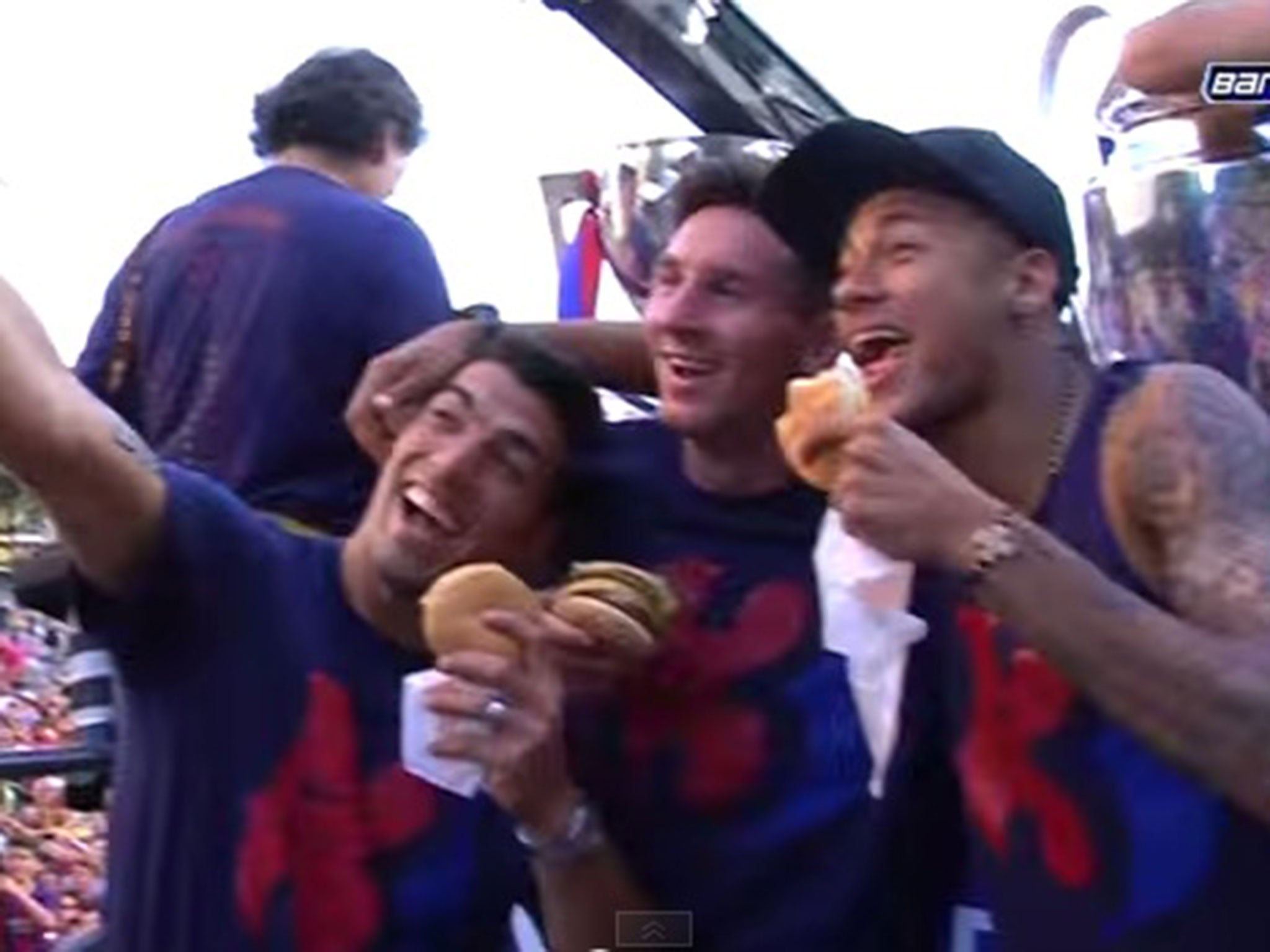 Luis Suarez, Lionel Messi and Neymar pose with their burgers