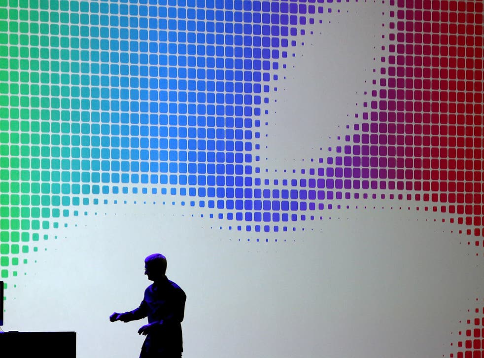 Apple CEO Tim Cook walks off stage after speaking during the Apple Worldwide Developers Conference at the Moscone West center on June 2, 2014 in San Francisco, California