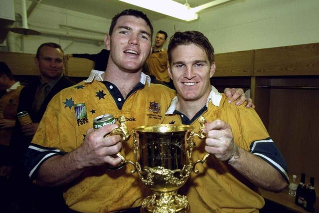 Daniel Herbert and Tim Horan (right) following the 1999 Rugby World Cup victory