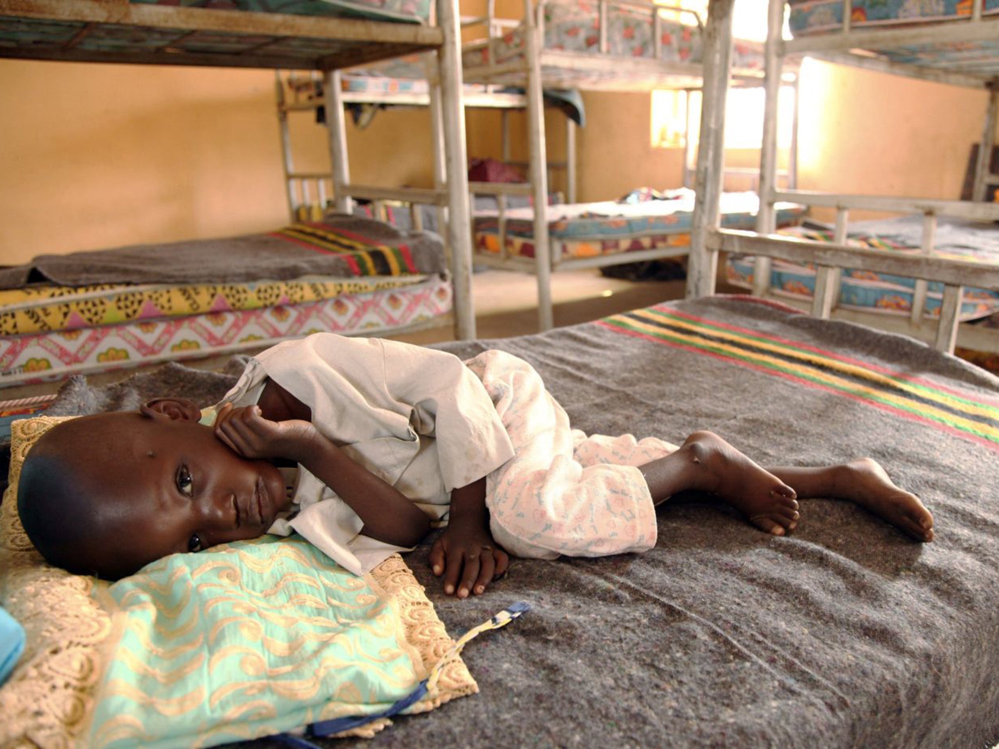 A child rescued from Boko Haram in the Sambisa forest rests at a refugee camp