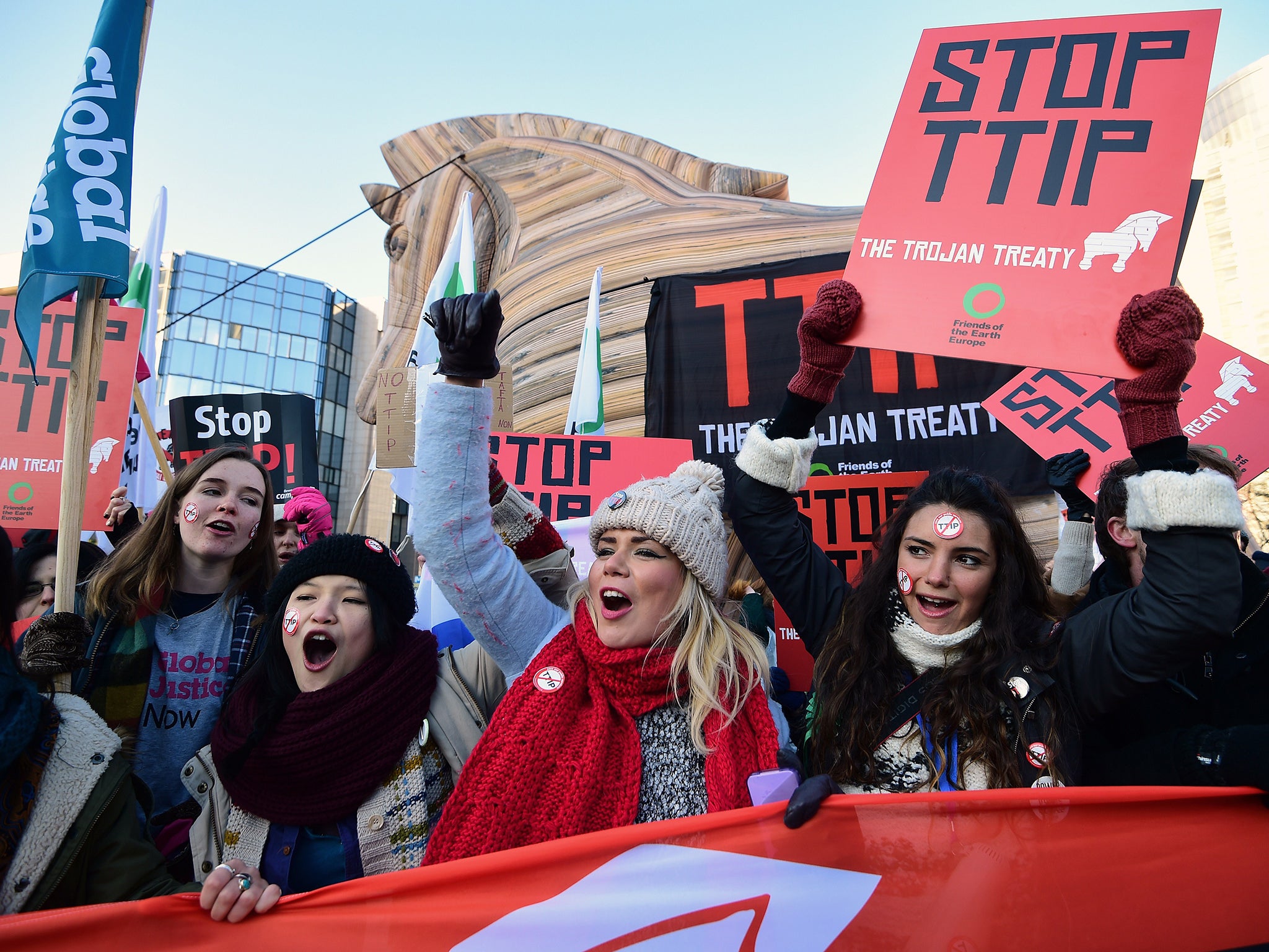 Demonstrators staging a protest against the Transatlantic Trade and Investment Pact (TTIP) in front of the the European institutions in Brussels in February (Getty)
