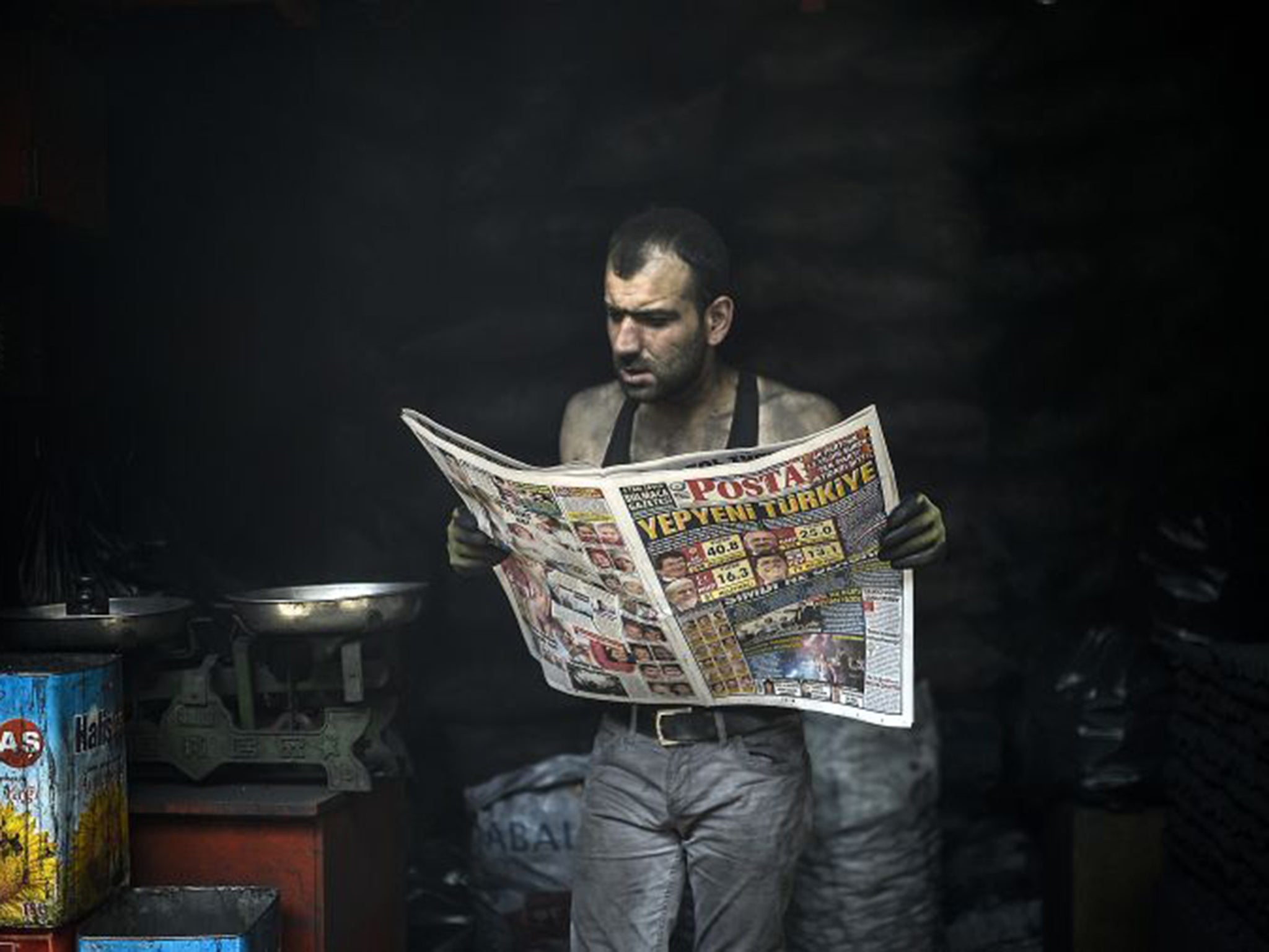 A man catches up on election news in the south-eastern Kurdish city of Diyarbakir. Now Recep Tayyip Erdogan’s AKP must weigh up its future strategy