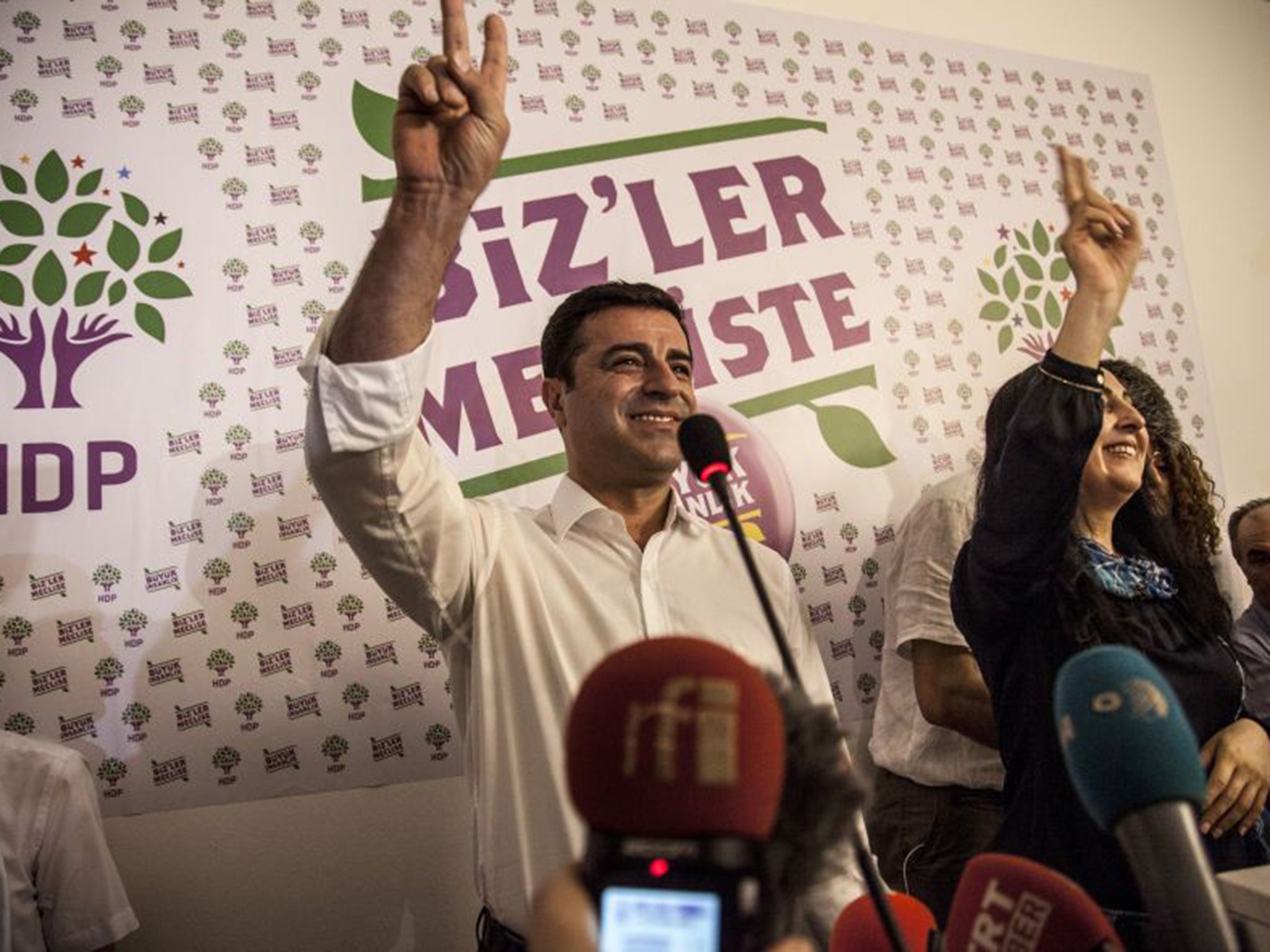 Selahattin Demirtas, left, and Figen Yuksekdag, co-chairs of the pro-Kurdish Peoples’ Democratic Party, celebrate