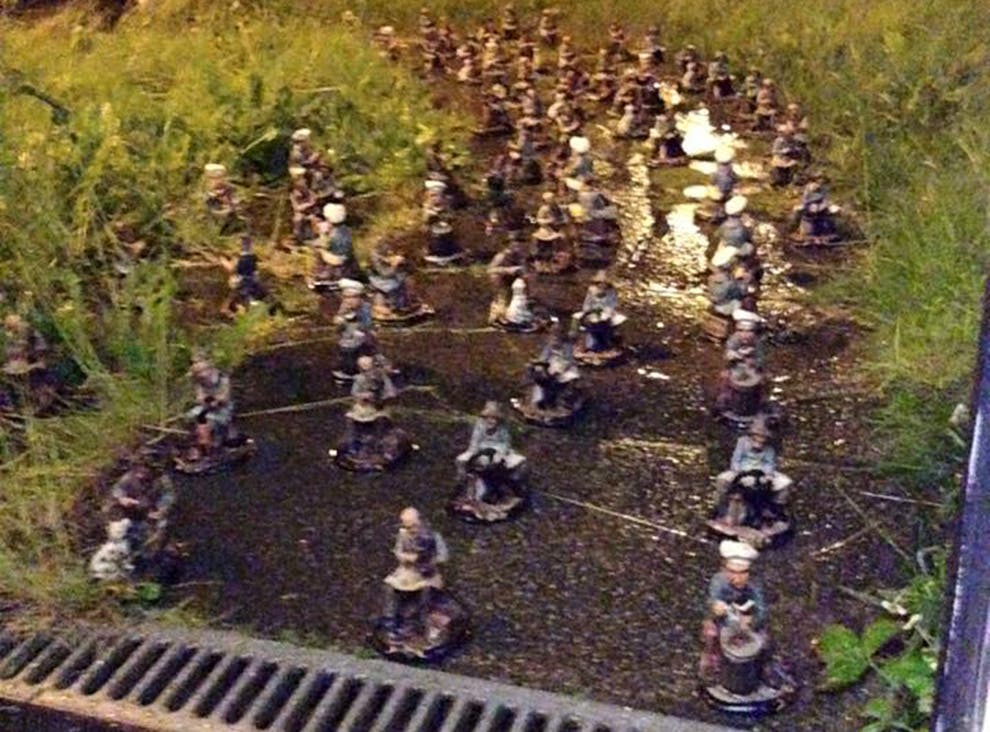 Game of Gnomes Woman returns home to find garden invaded Game of Gnomes Woman returns home to find garden invaded