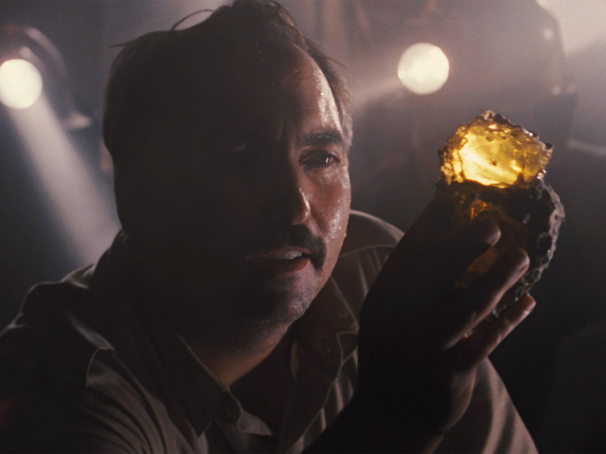 A scene at the start of the original 'Jurassic Park' movie, in which a mosquito entombed in amber is discovered