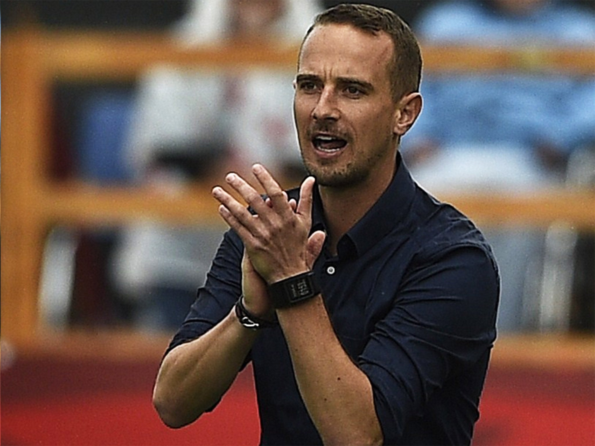 England's head coach Mark Sampson encourages his players from the sideline