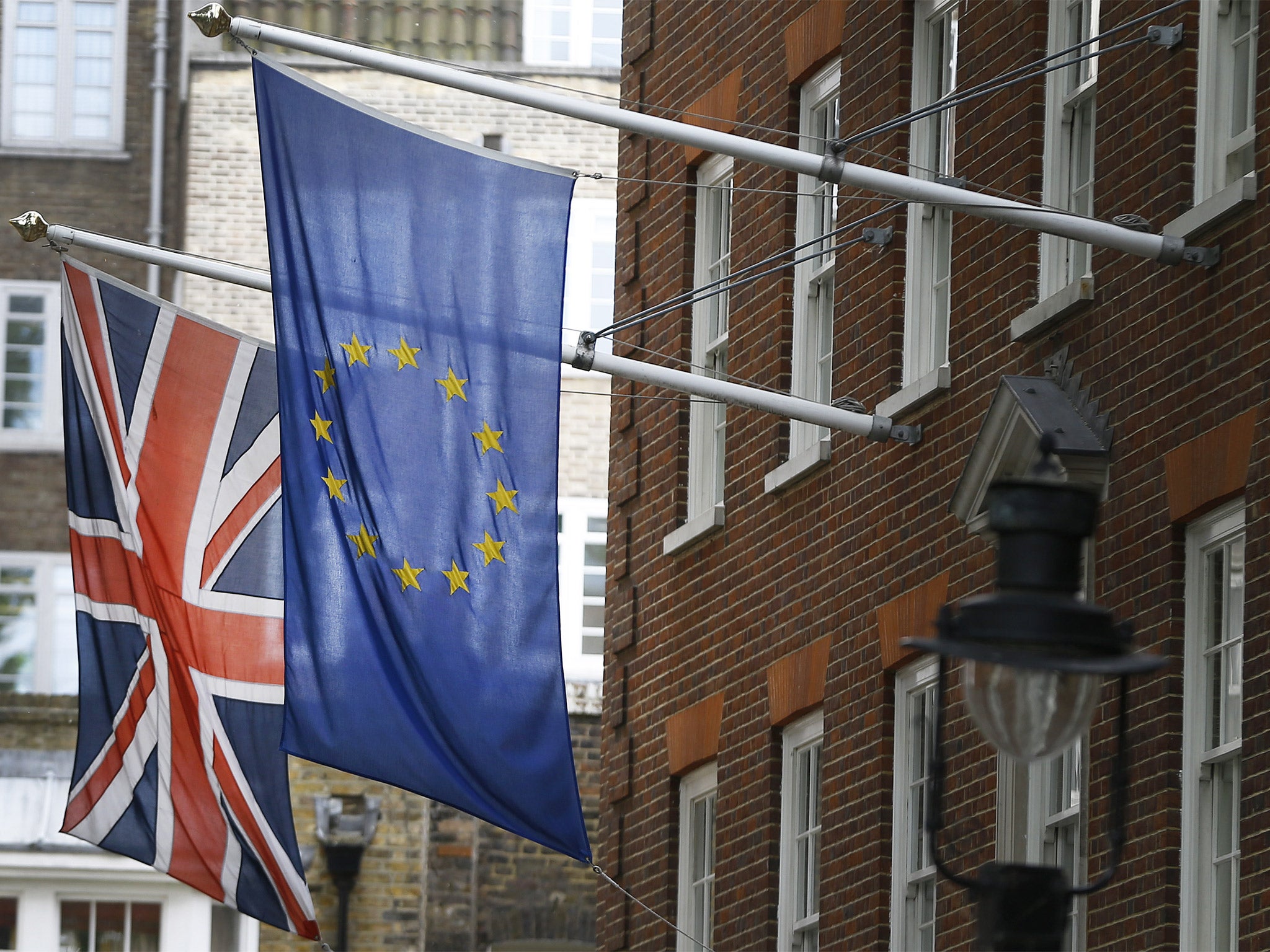 The Union flag and the European Union flag fly outside Europe House,  in London