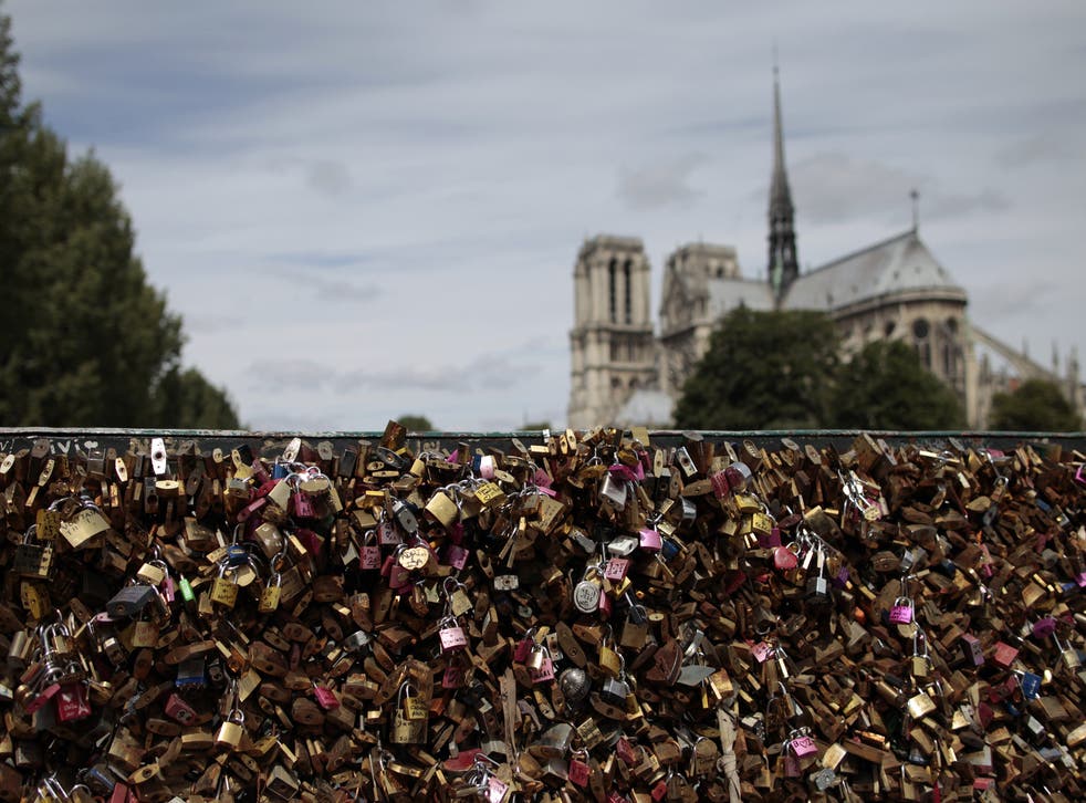  The love padlocks, which had been a romantic ritual for many couples visiting the French capital, will now be sold with proceeds going to refugees in the city 