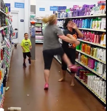 The two women throw punches in the shampoo aisle