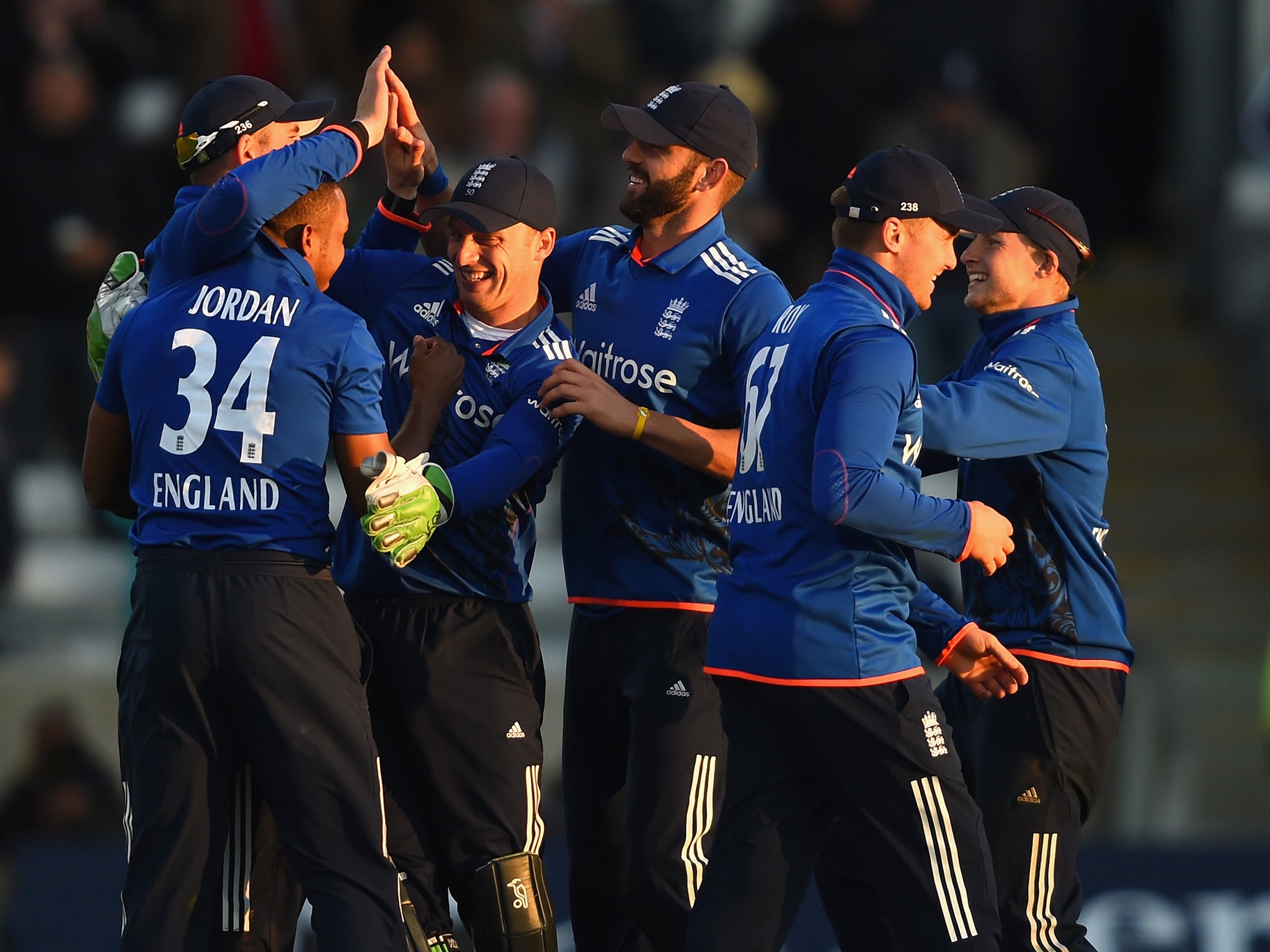 England players celebrate on their way to a record breaking win