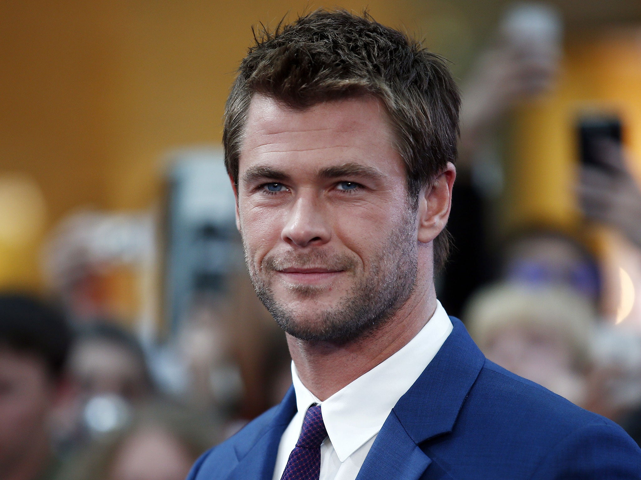 Chris Hemsworth is known for major action roles but will soon be seen behind a desk in the all-female Ghostbusters