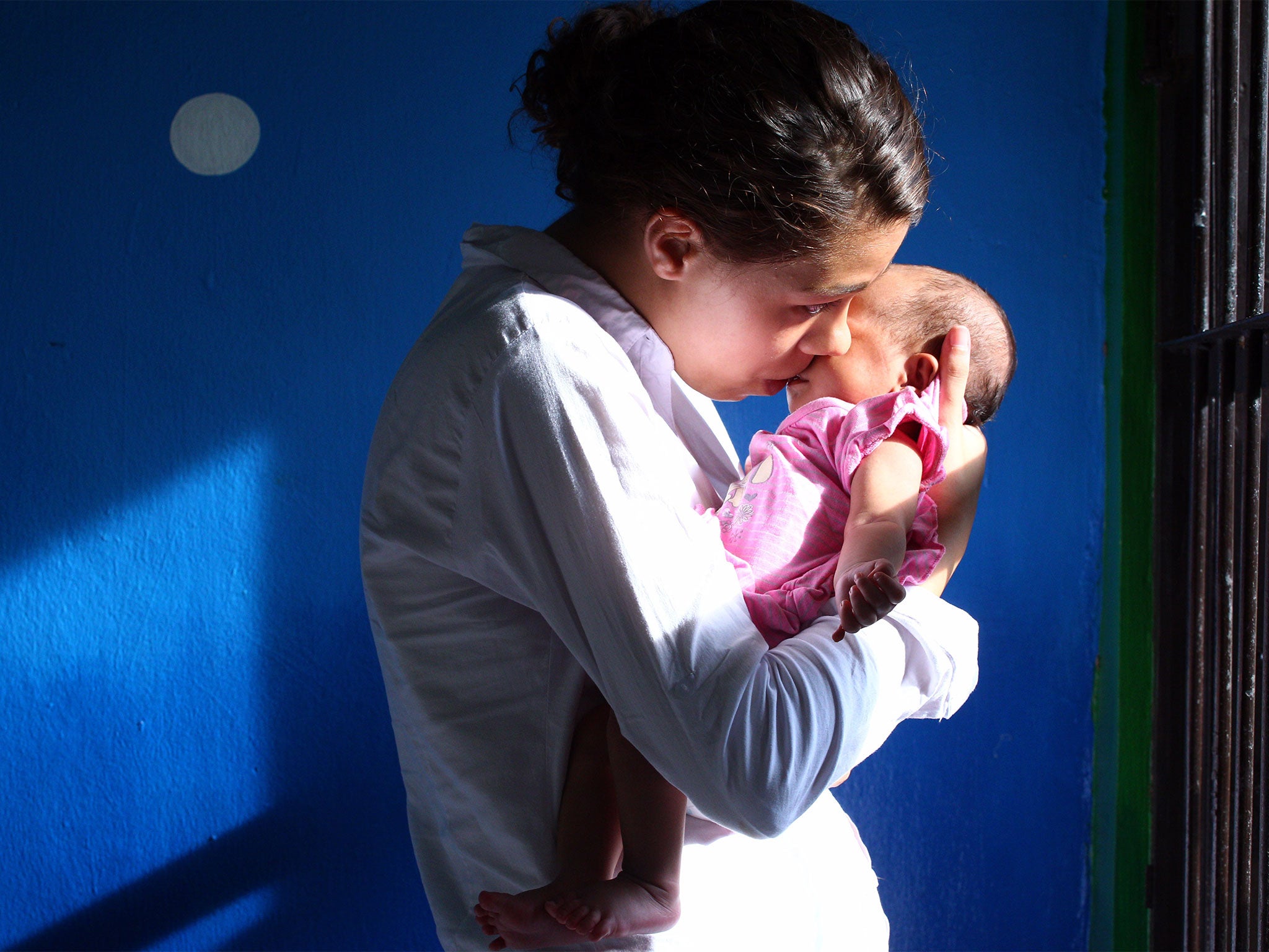 Heather Mack with her baby daughter inside a prison cell in Indonesia