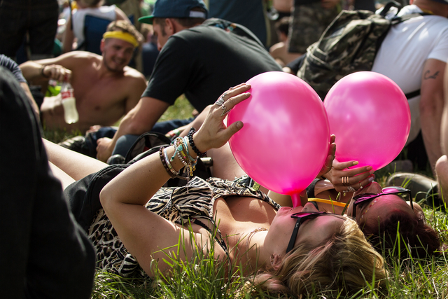 "A vitally important question is at stake here: should you have the right to alter your own consciousness in whatever way you choose?" Two festival-goers inhale laughing gas at Glastonbury 