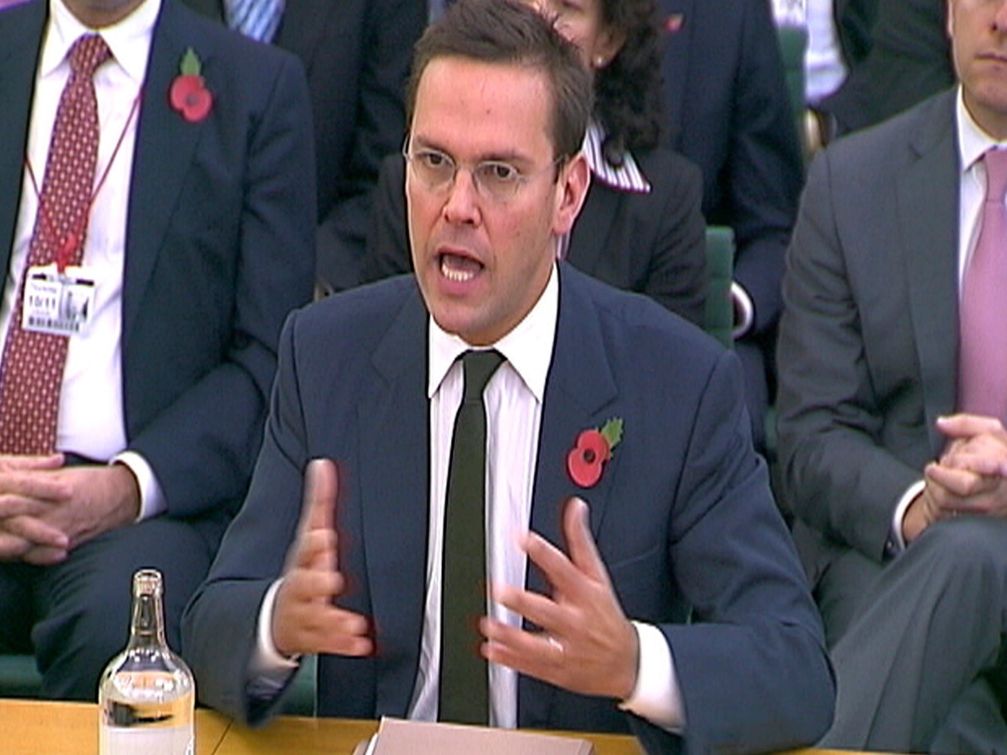 James Murdoch talking to members of the British parliament