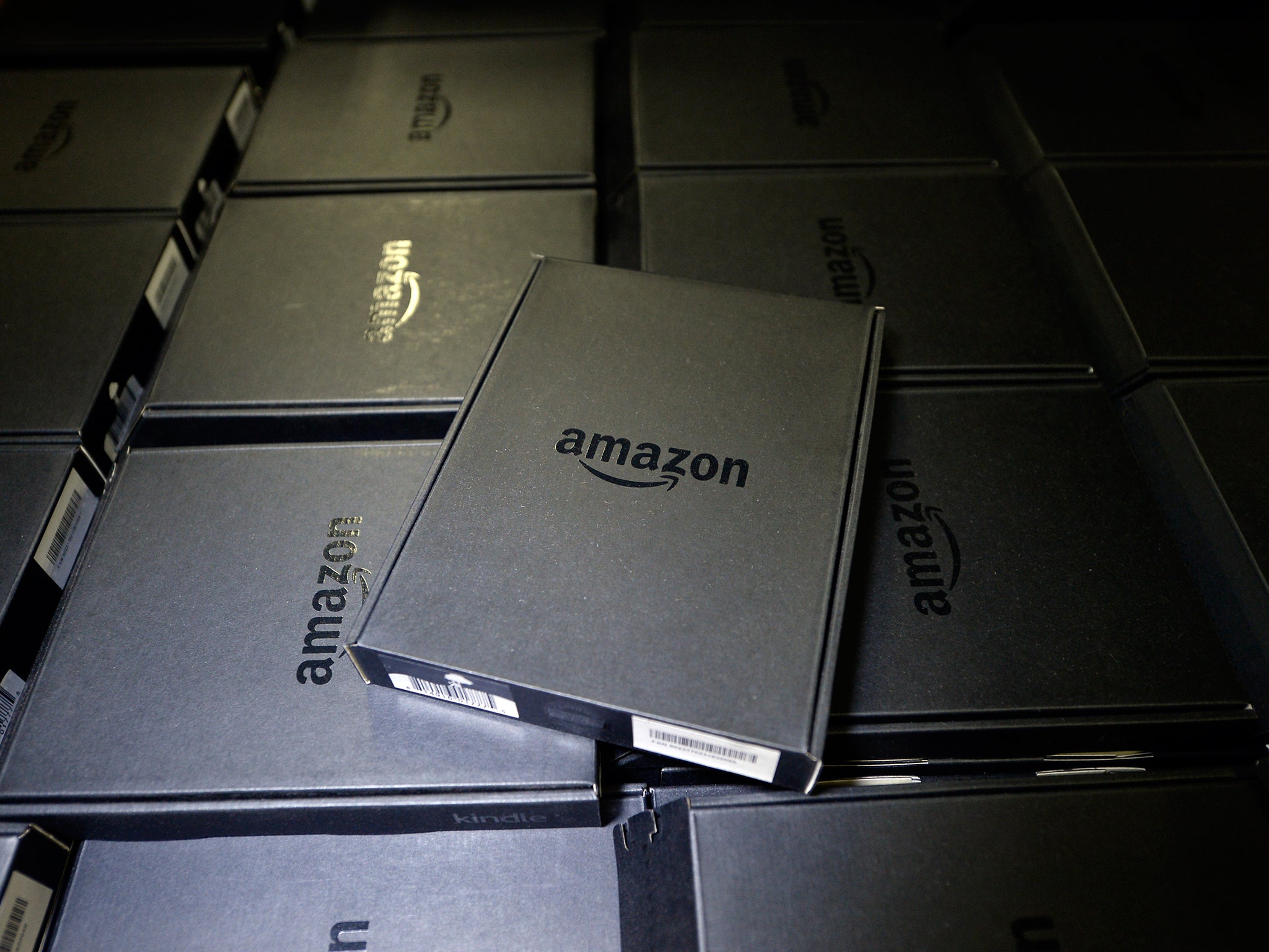 Kindle electronic readers are stacked at Amazon's San Bernardino Fulfillment Center