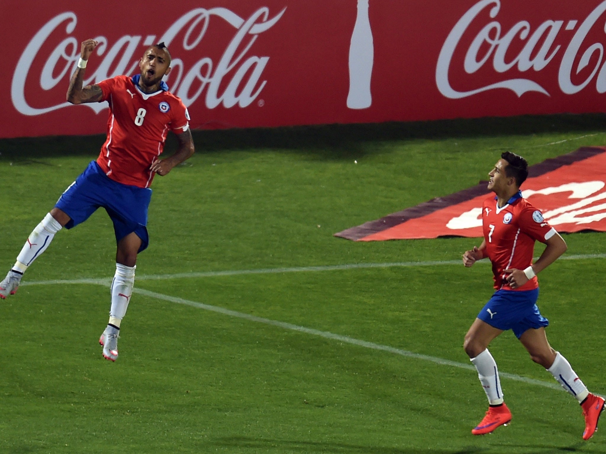 Vidal celebrates with Sanchez after scoring