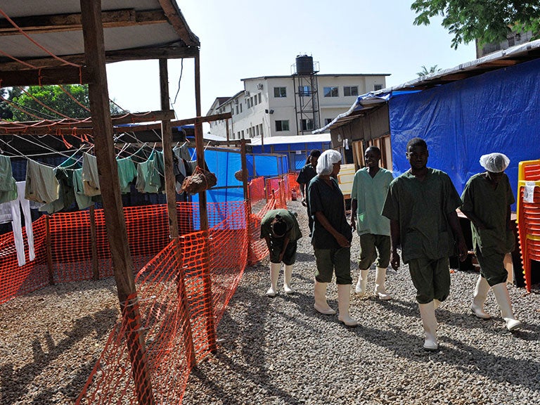 Workers at the Donka Ebola treatment center in Conakry in Guinea