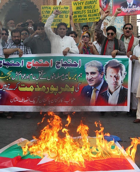 Activists in Pakistan burn a Myanmar flag during a protest in support of Rohingya Muslims last week