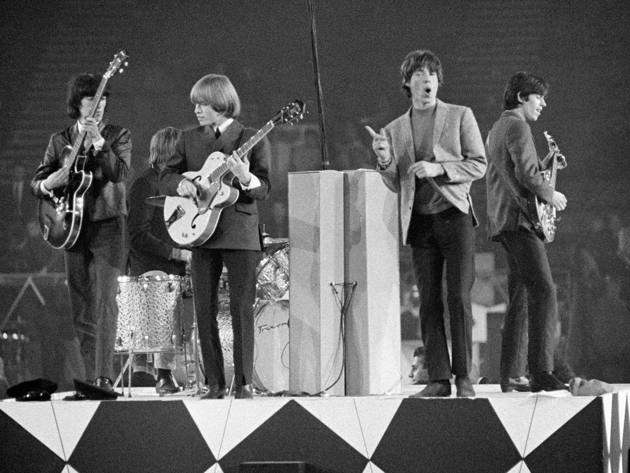 The Rolling Stones performing in concert in 1964