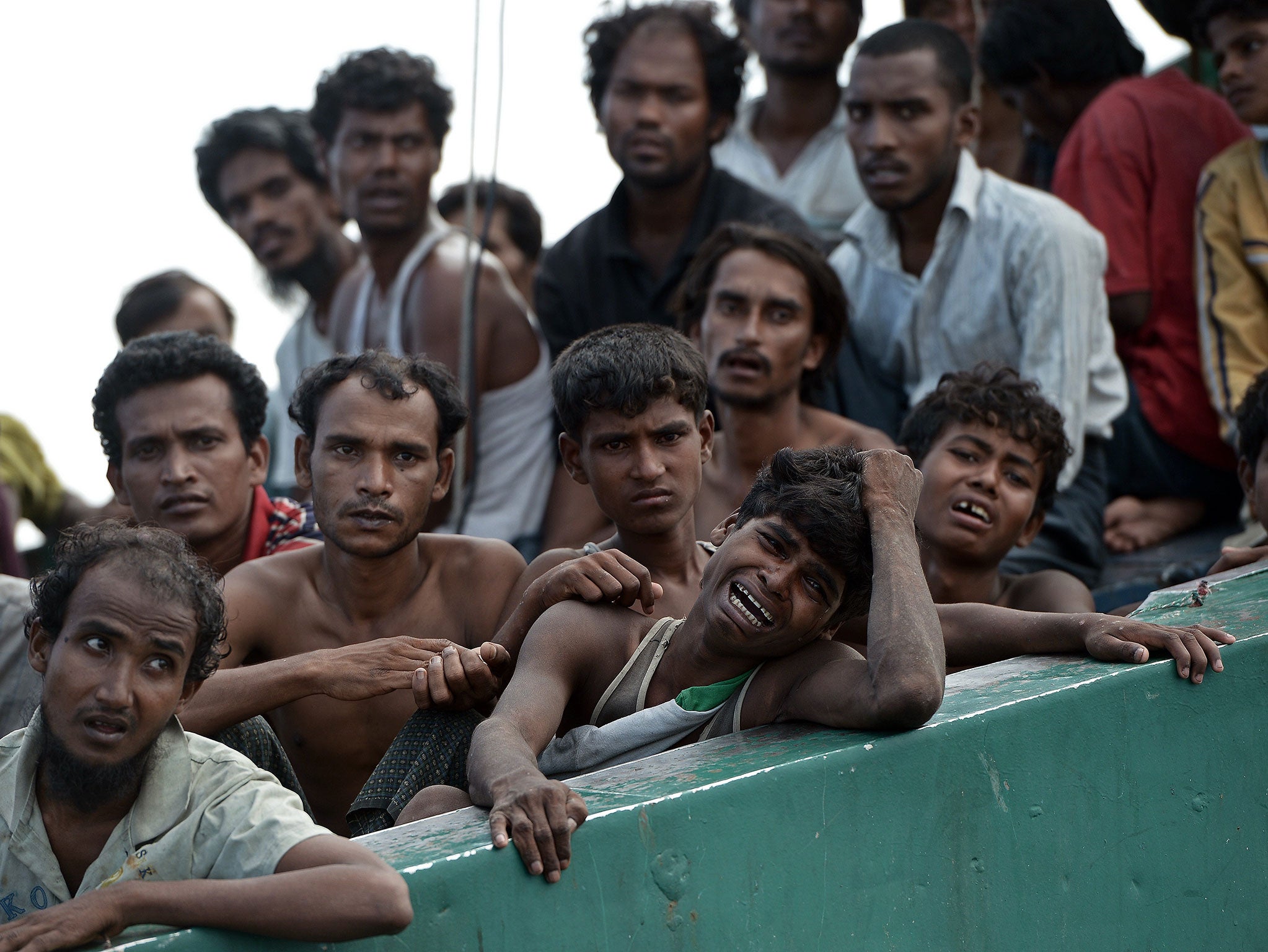 Migrants on board a ship in the Indian Ocean