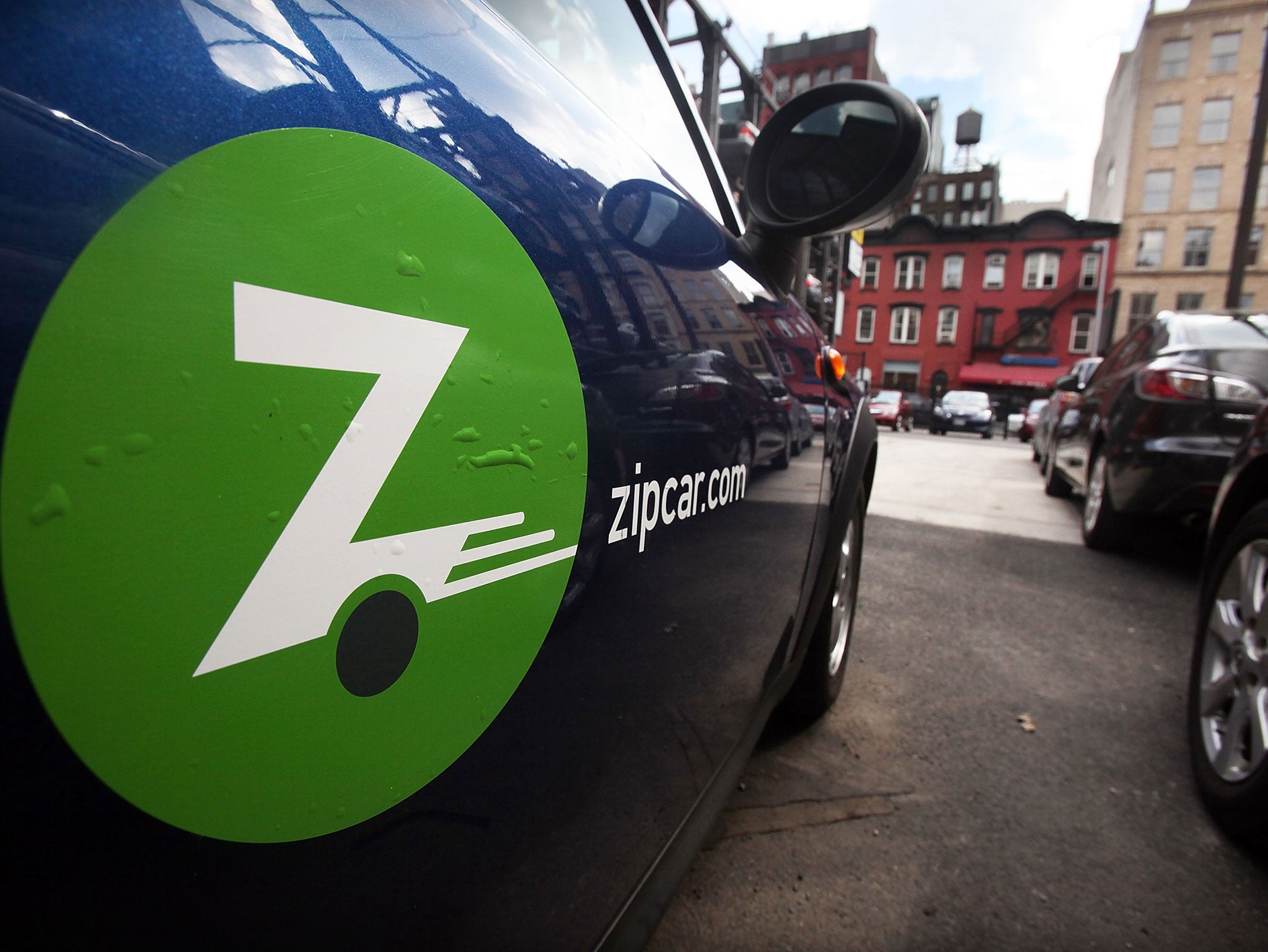 A Zipcar is seen in a Manhattan parking lot June 3, 2010 in New York City