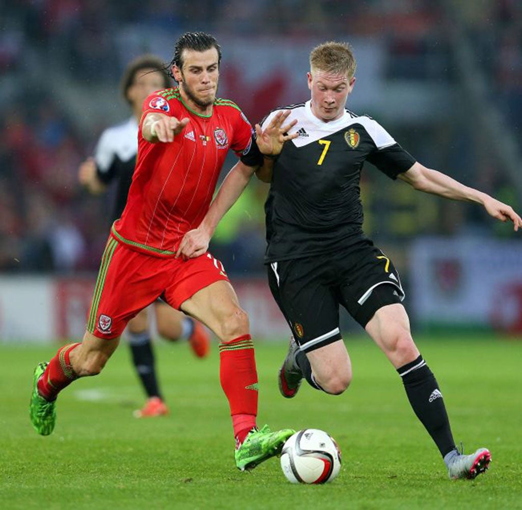 Bale battles with Belgium's Kevin De Bruyne