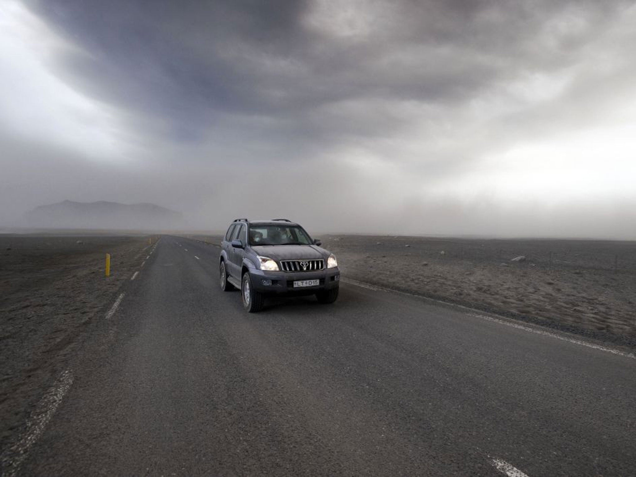 Insurance black spot: a car drives under a volcanic ash cloud in Iceland