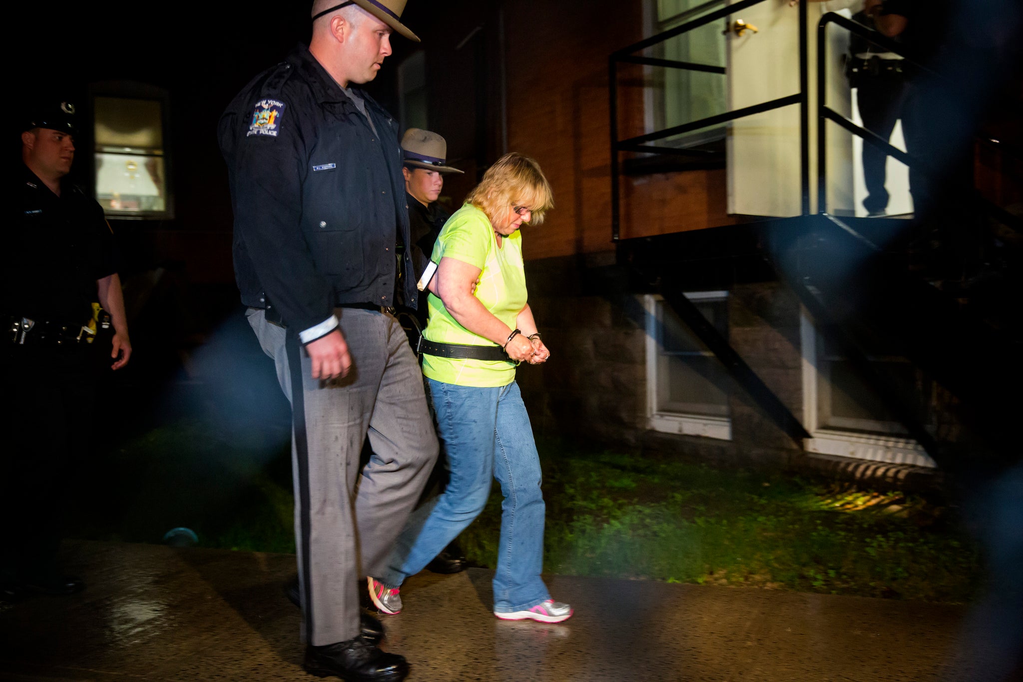 Joyce Mitchell is led into court for her arraignment