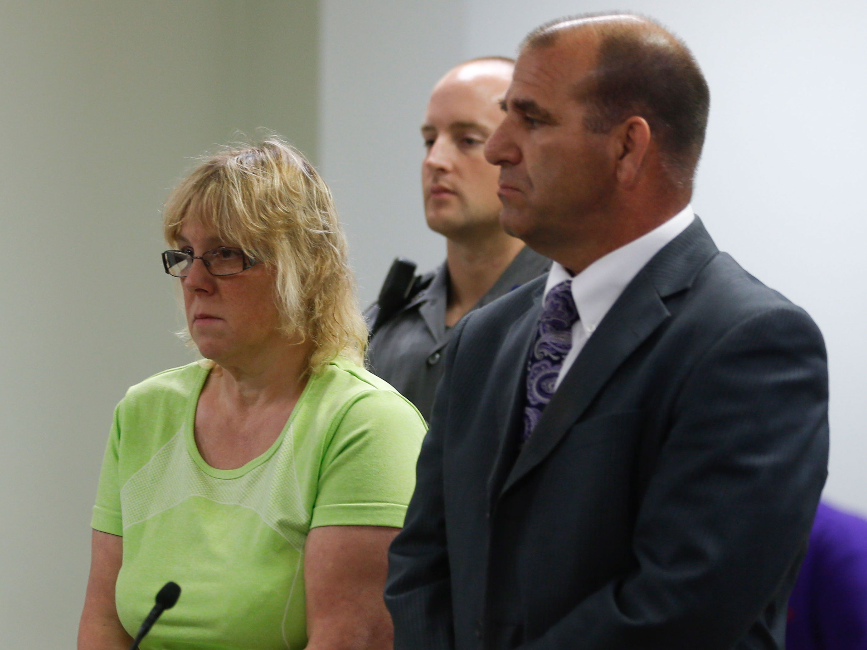 Joyce Mitchell looks on as her charges are read out