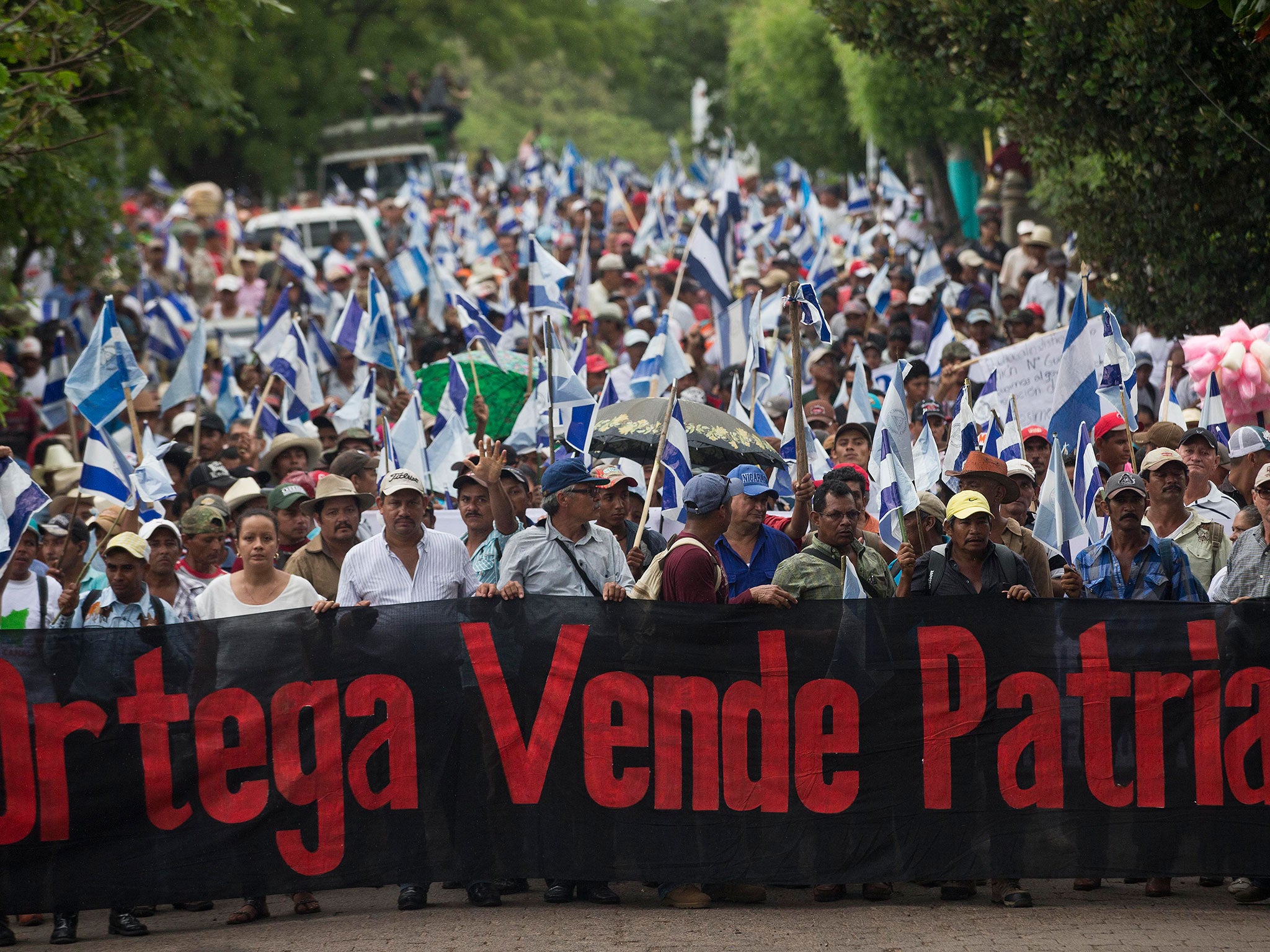 Opponents to the construction of Nicaragua's transoceanic canal take part in a national protest march against the canal project, in Juigalpa, Nicaragua. The banner reads: "Ortega traitor."