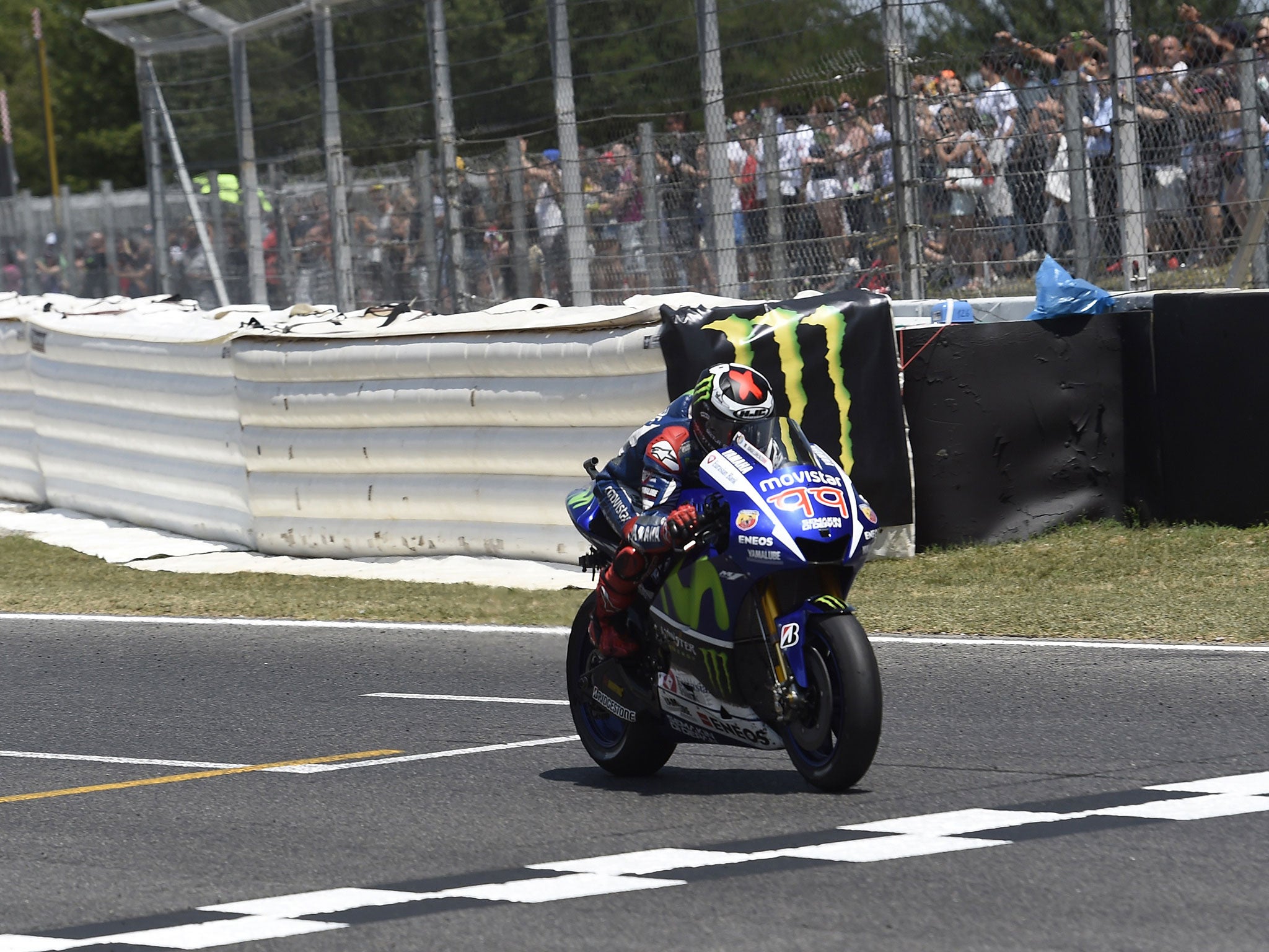 Jorge Lorenzo crosses the line to take victory at Catalunya