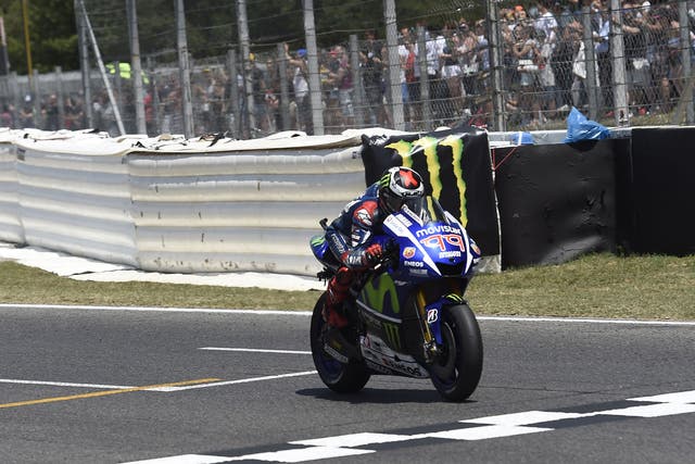 Jorge Lorenzo crosses the line to take victory at Catalunya